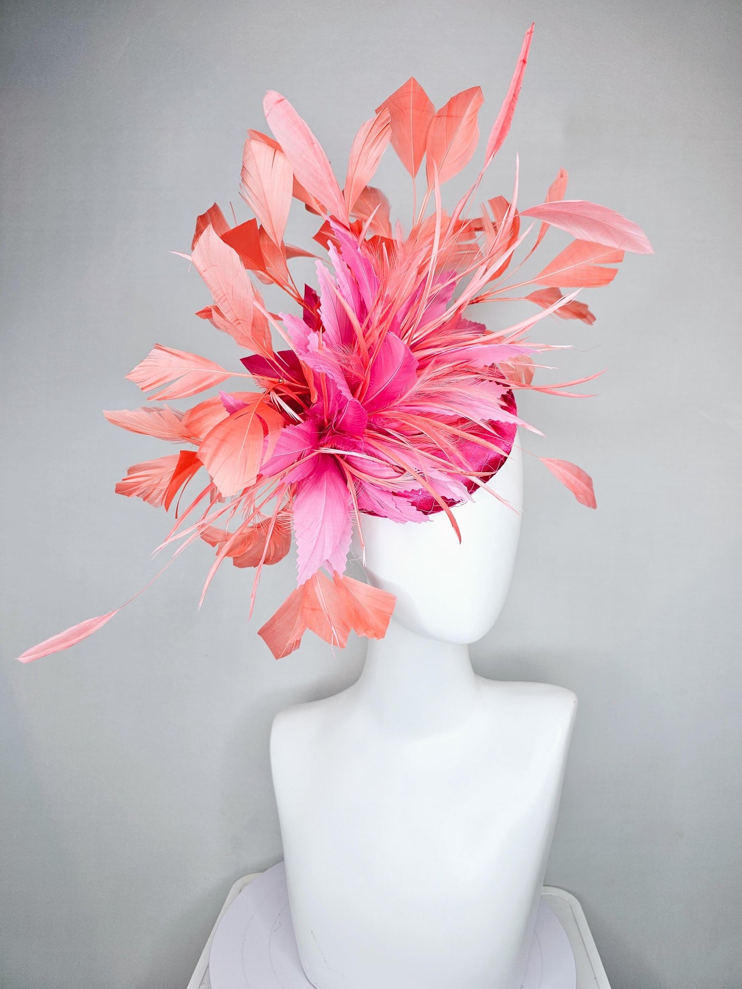kentucky derby hat fascinator hot pink satin with netting,and light pink feather flowers with coral orange peach branching feathers