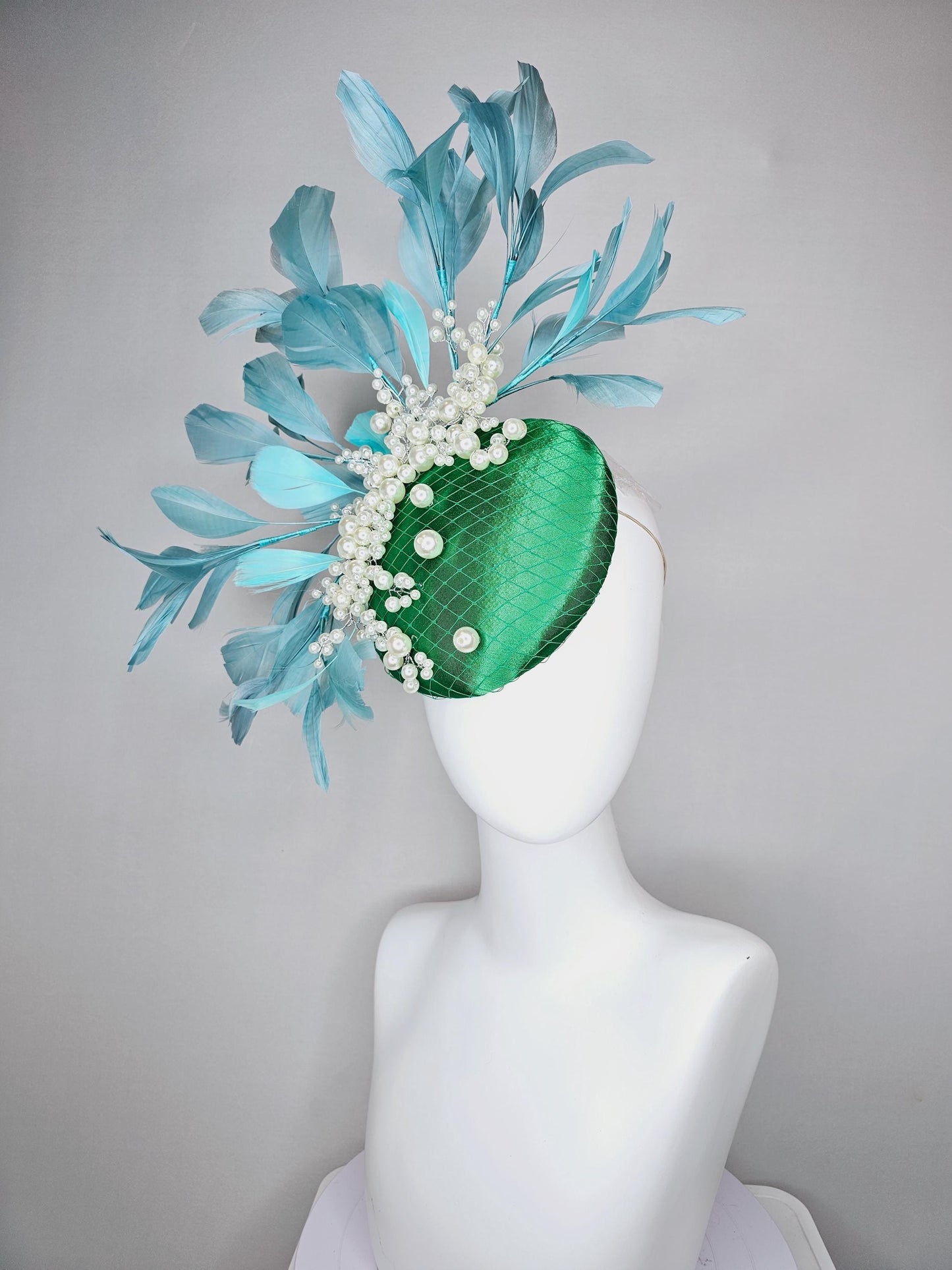 kentucky derby hat fascinator emerald green satin with netting and pearl beaded stems, teal blue branching feathers