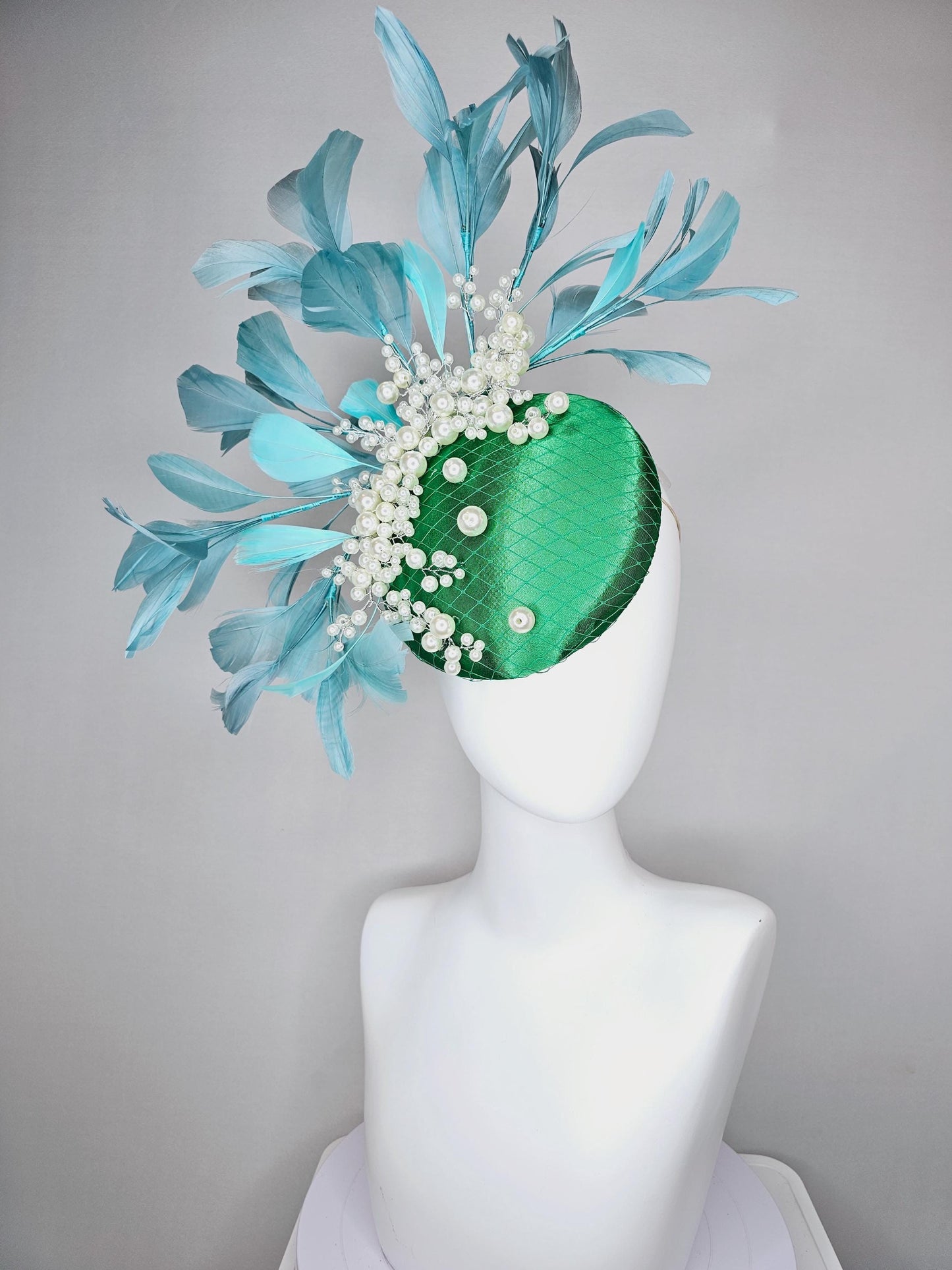 kentucky derby hat fascinator emerald green satin with netting and pearl beaded stems, teal blue branching feathers