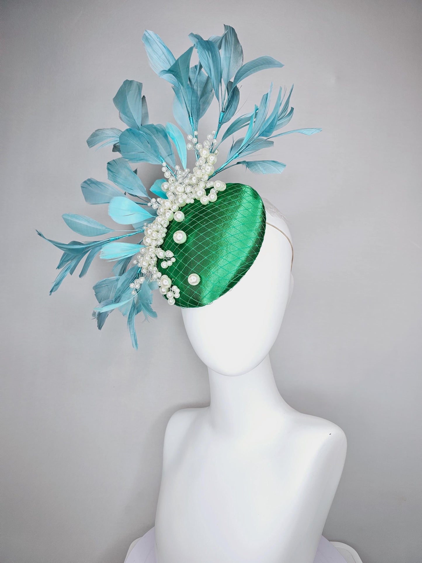 kentucky derby hat fascinator emerald green satin with netting and pearl beaded stems, teal blue branching feathers