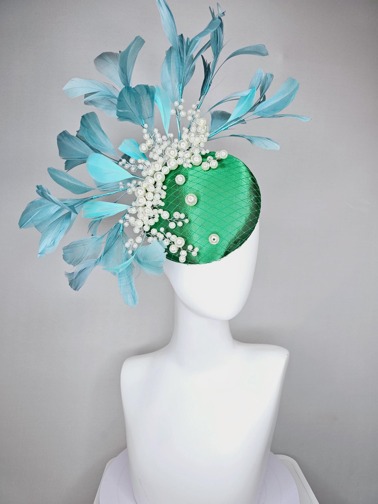 kentucky derby hat fascinator emerald green satin with netting and pearl beaded stems, teal blue branching feathers