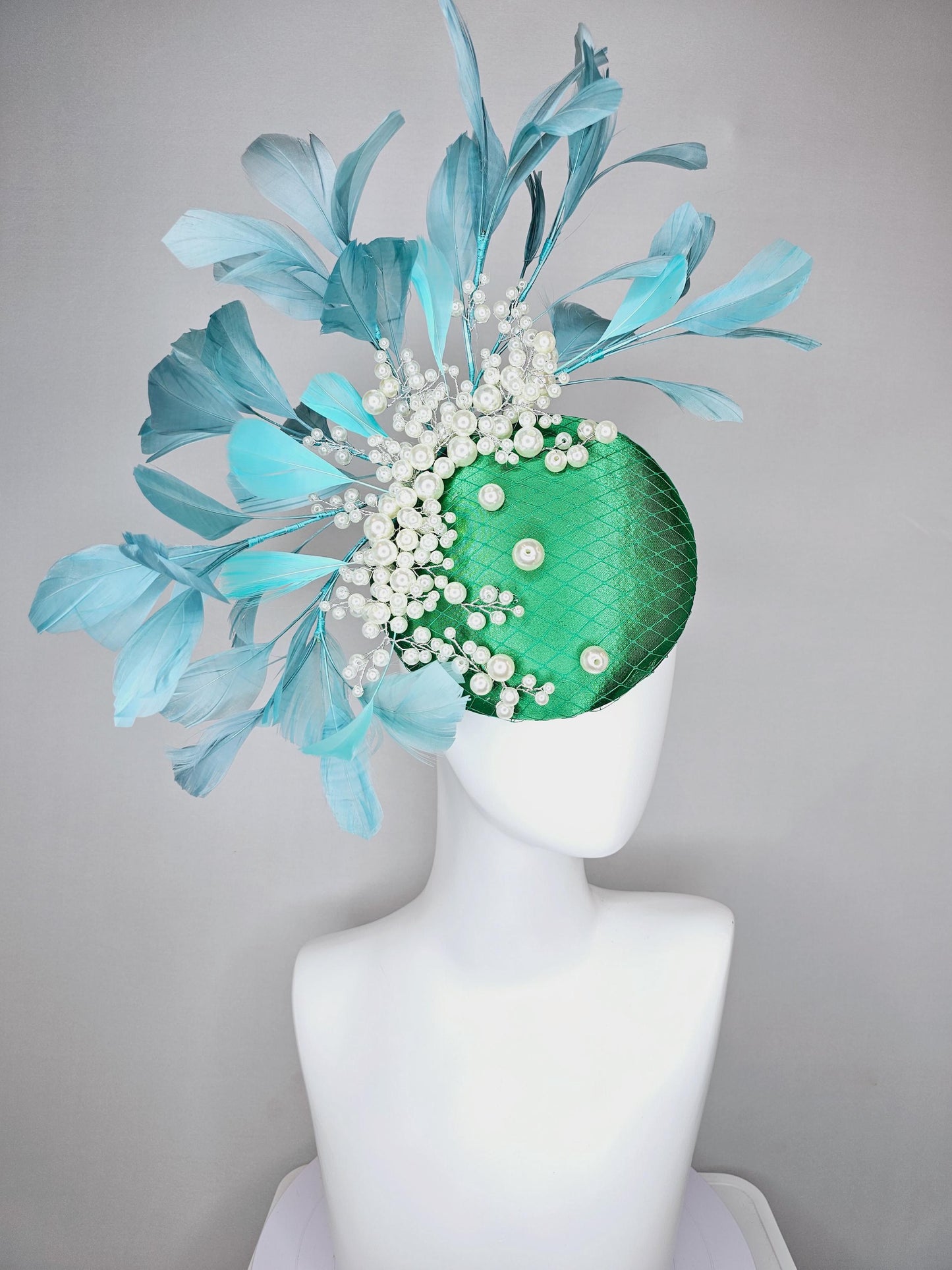 kentucky derby hat fascinator emerald green satin with netting and pearl beaded stems, teal blue branching feathers