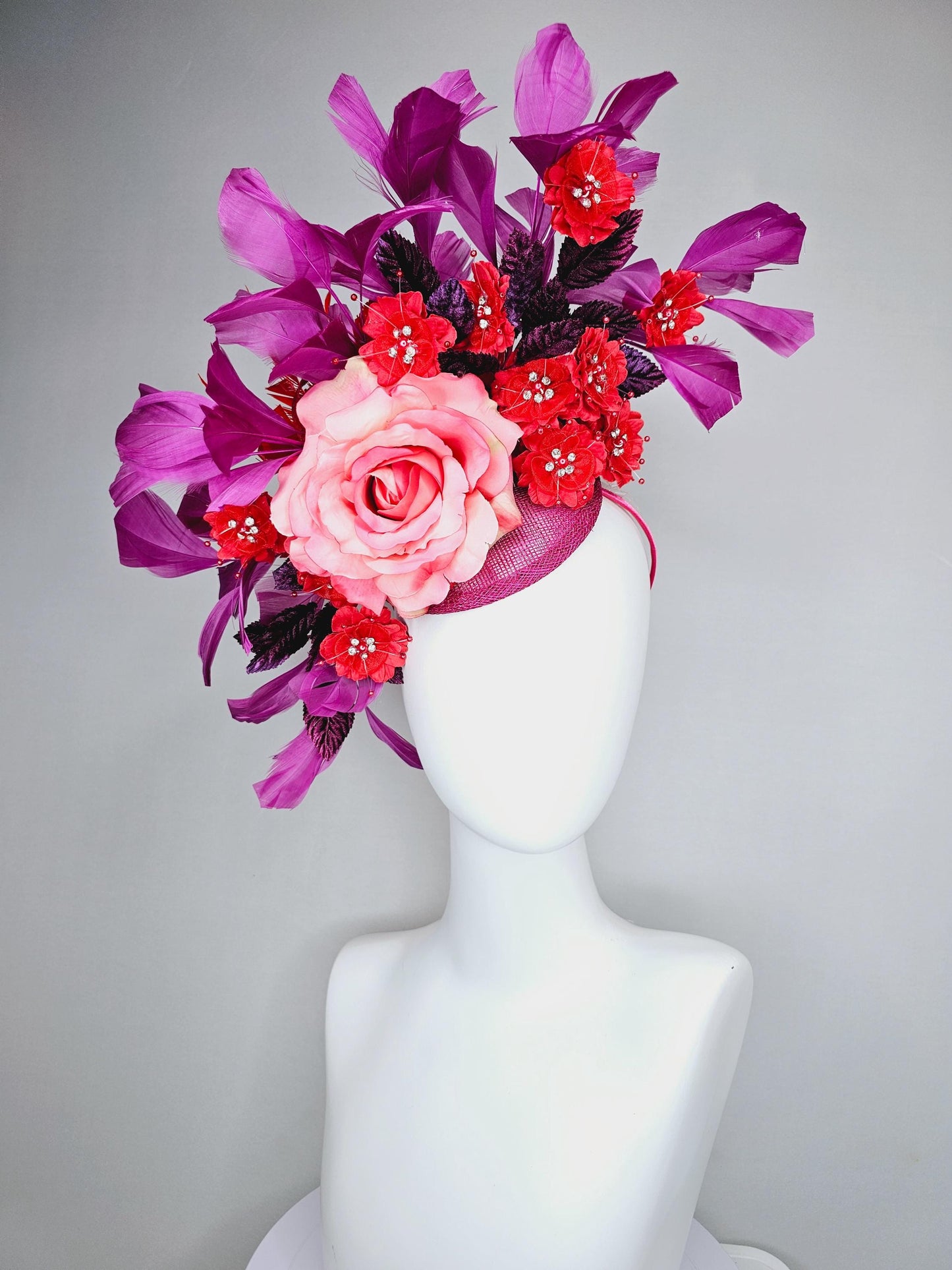 kentucky derby hat fascinator pink ombre satin rose, scarlet red satin flowers, purple leaves, magenta purple branching feathers