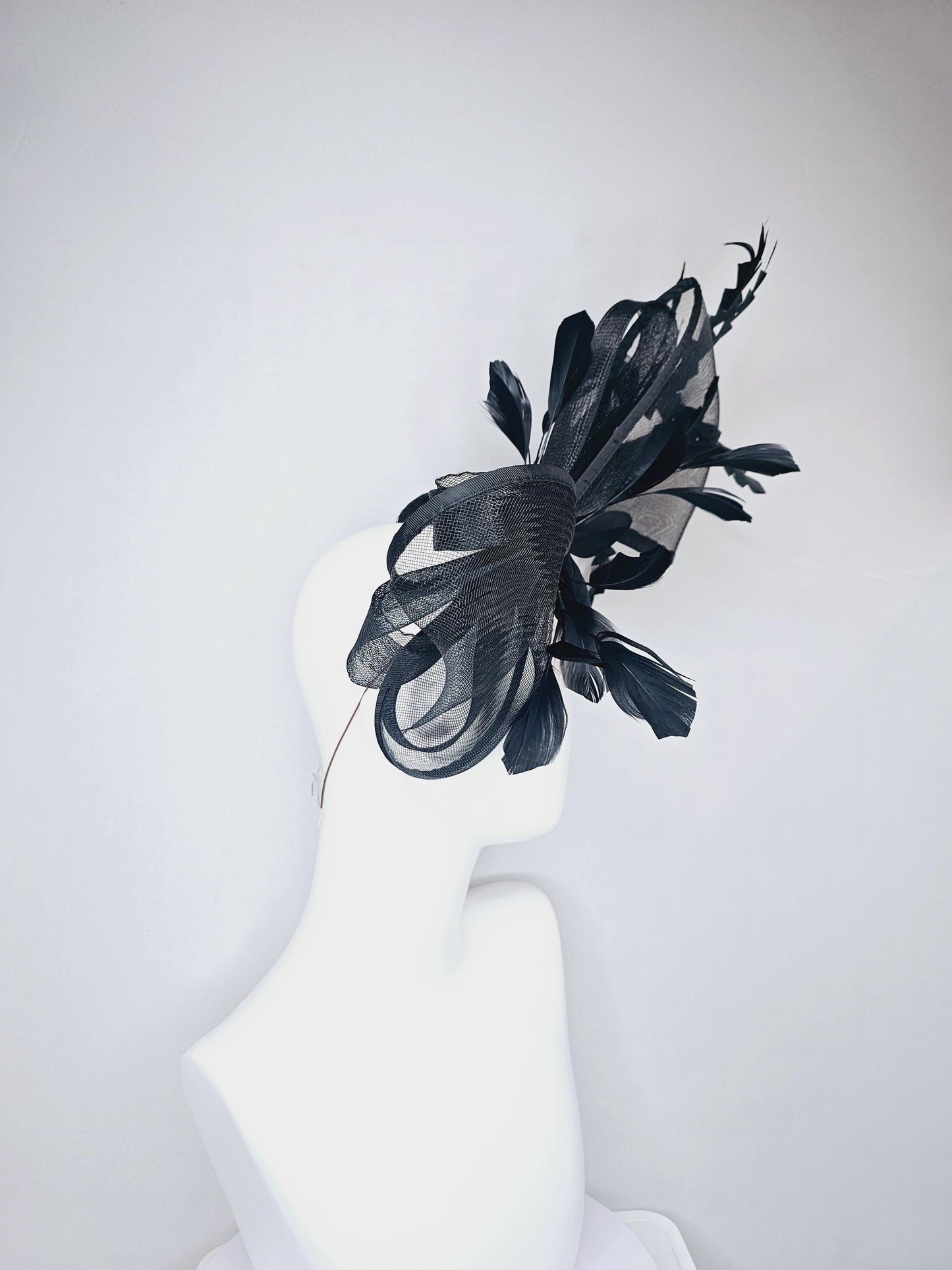 kentucky derby hat fascinator black satin with netting with large black mesh bow and black zigzag branching feathers