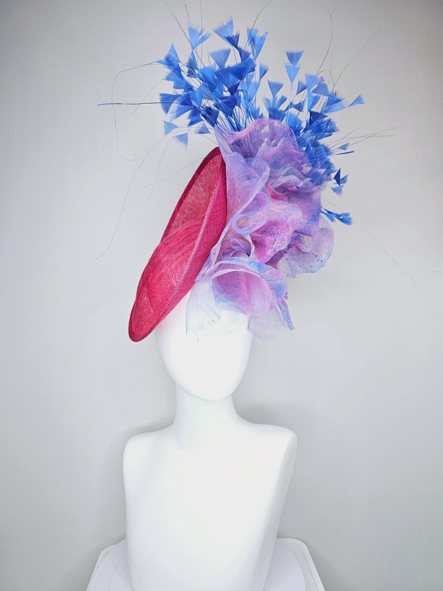 kentucky derby hat fascinator raspberry pink sinamay saucer with large pink blue tie dye organza satin rose, cobalt blue branching feathers