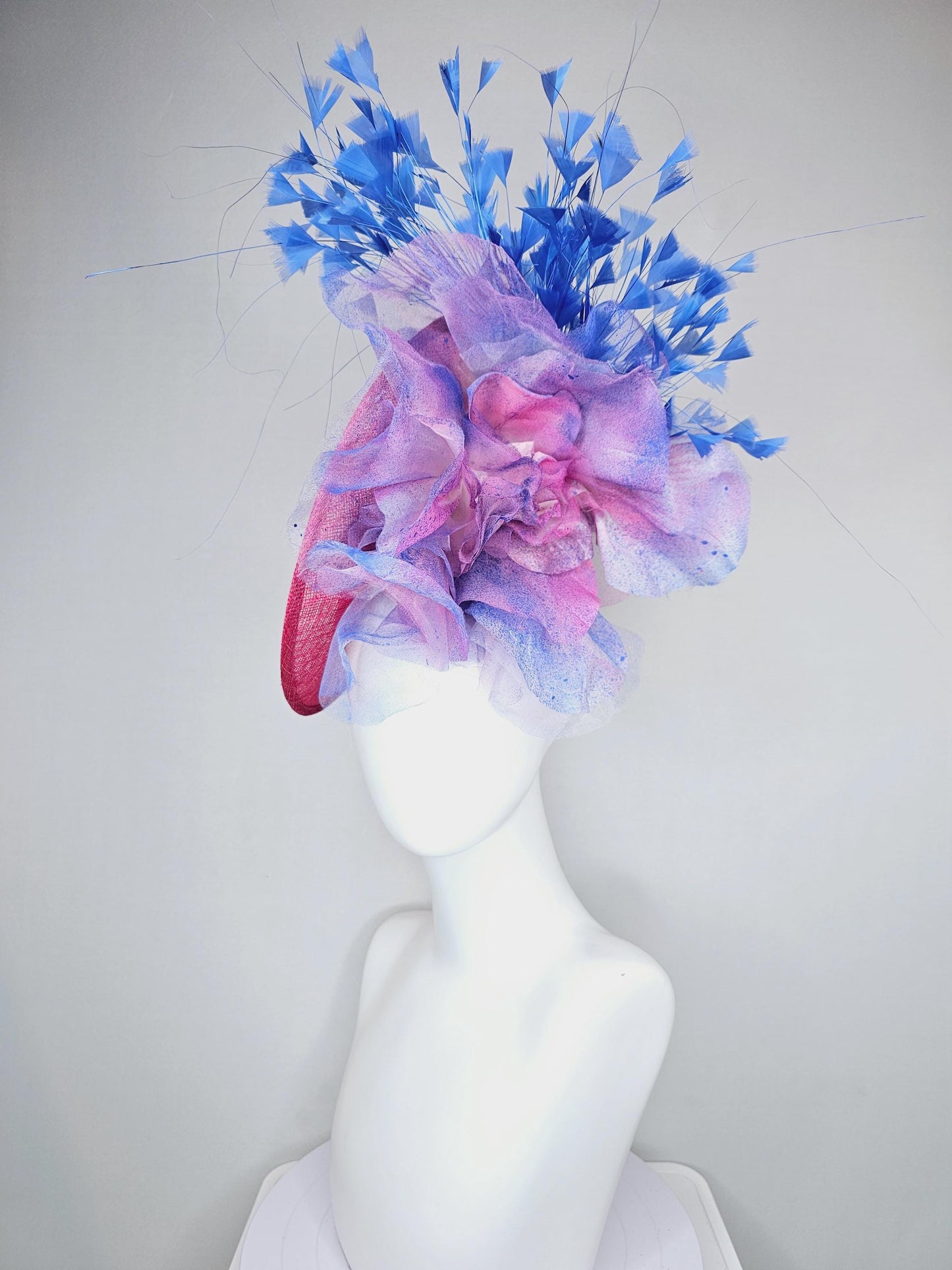 kentucky derby hat fascinator raspberry pink sinamay saucer with large pink blue tie dye organza satin rose, cobalt blue branching feathers