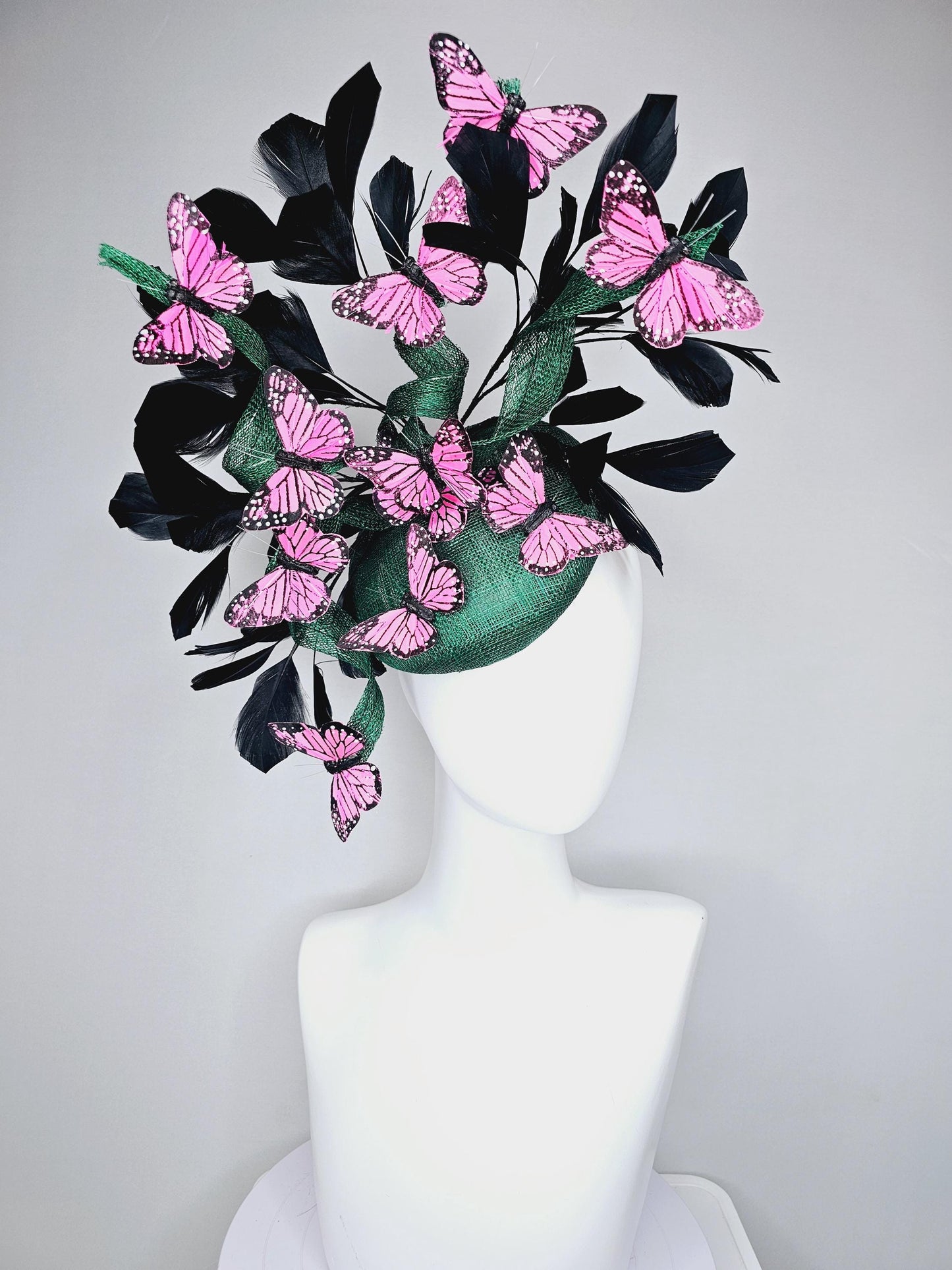 kentucky derby hat fascinator dark green sinamay with sinamay curls and black branching feathers with pink and black butterflies