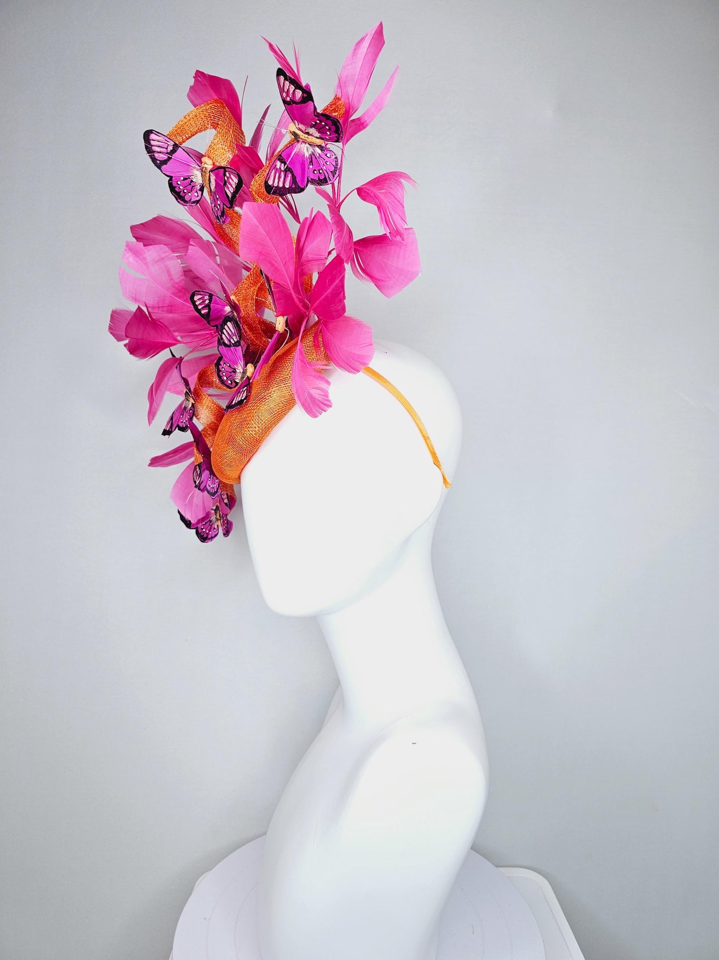 kentucky derby hat fascinator tangerine orange sinamay with sinamay curls and hot pink branching feathers with pink and black butterflies