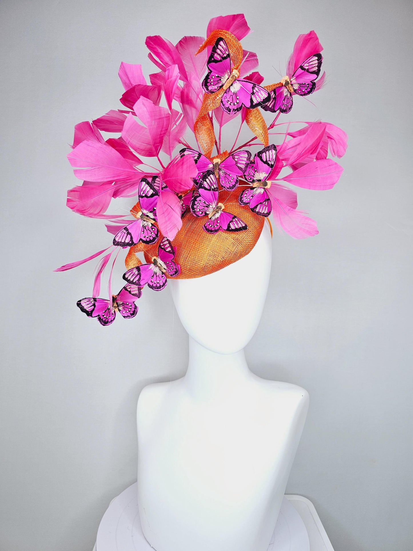 kentucky derby hat fascinator tangerine orange sinamay with sinamay curls and hot pink branching feathers with pink and black butterflies