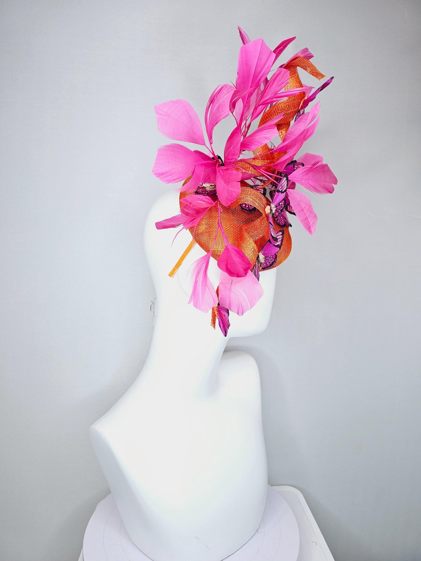 kentucky derby hat fascinator tangerine orange sinamay with sinamay curls and hot pink branching feathers with pink and black butterflies