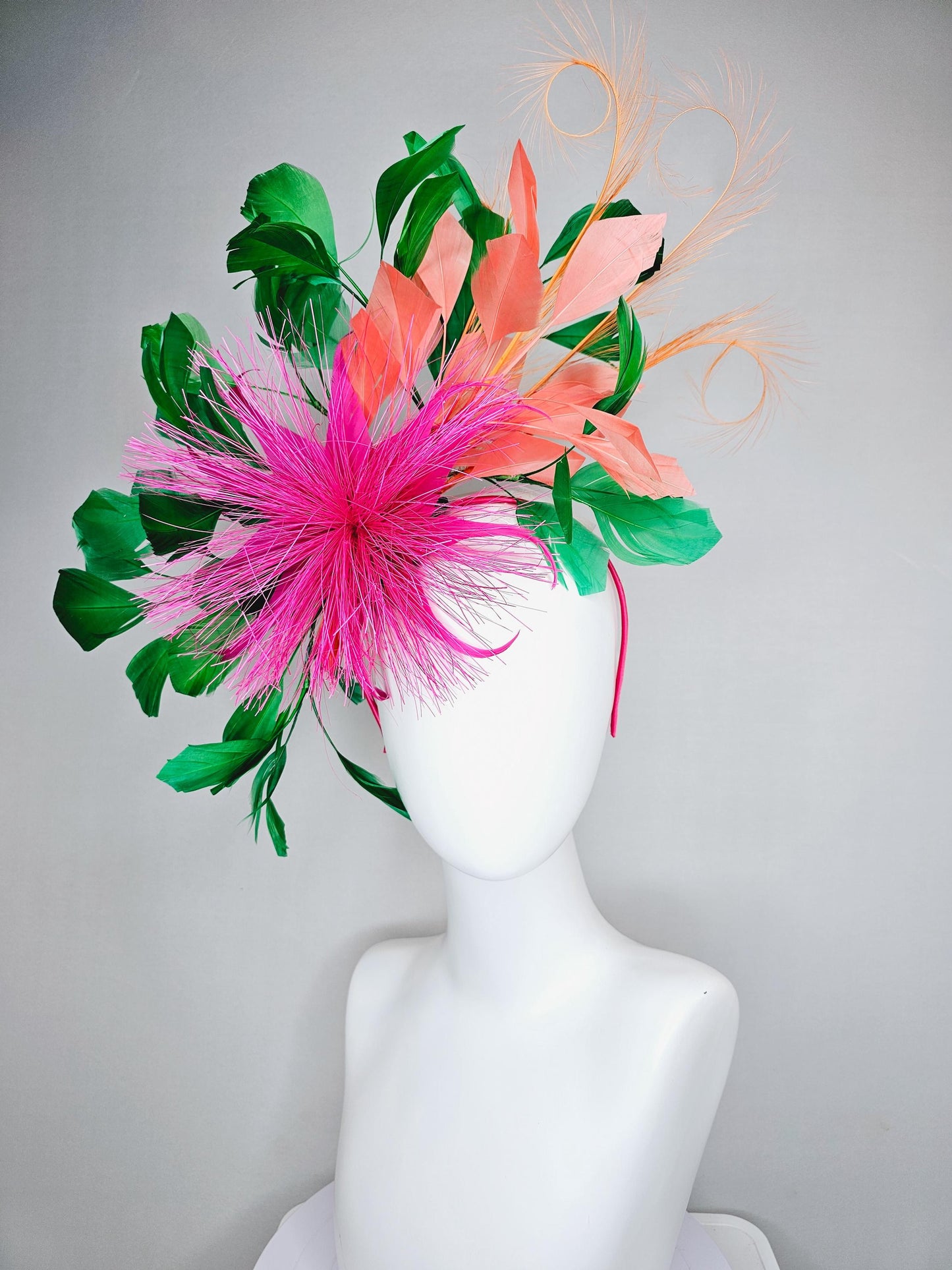 kentucky derby hat fascinator pink spiky feather flower light orange peach emerald green branching feathers and light peach feather curls