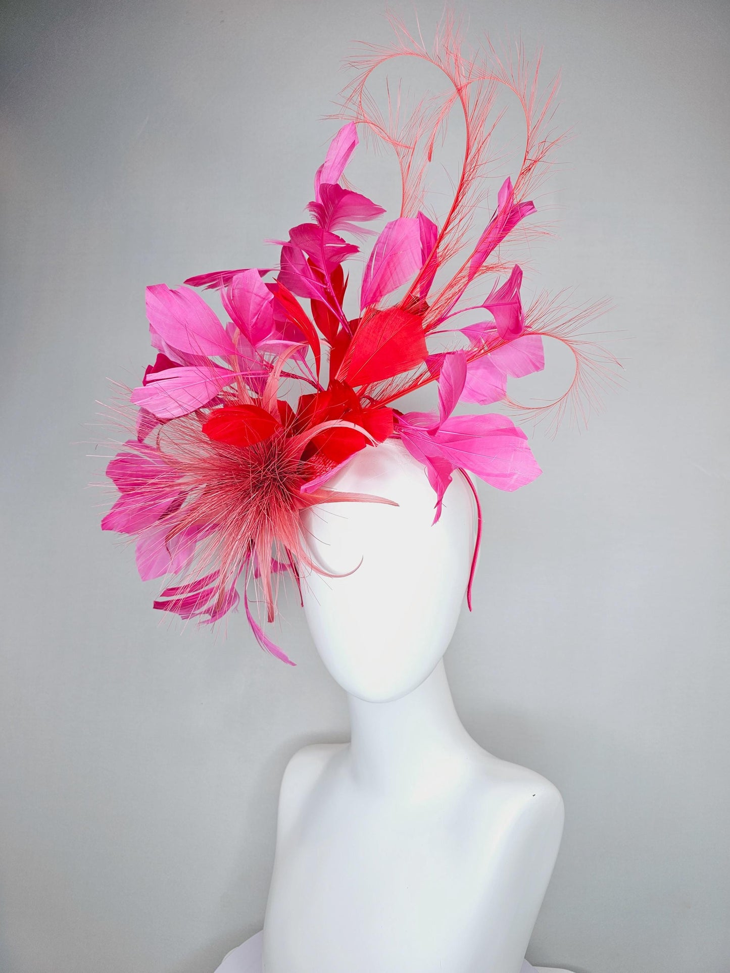 kentucky derby hat fascinator light red spiky feather flower, cherry scarlet red and pink branching feathers and light red feather curls