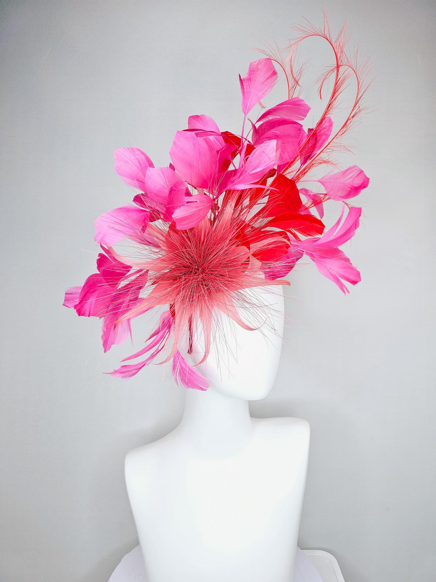 kentucky derby hat fascinator light red spiky feather flower, cherry scarlet red and pink branching feathers and light red feather curls