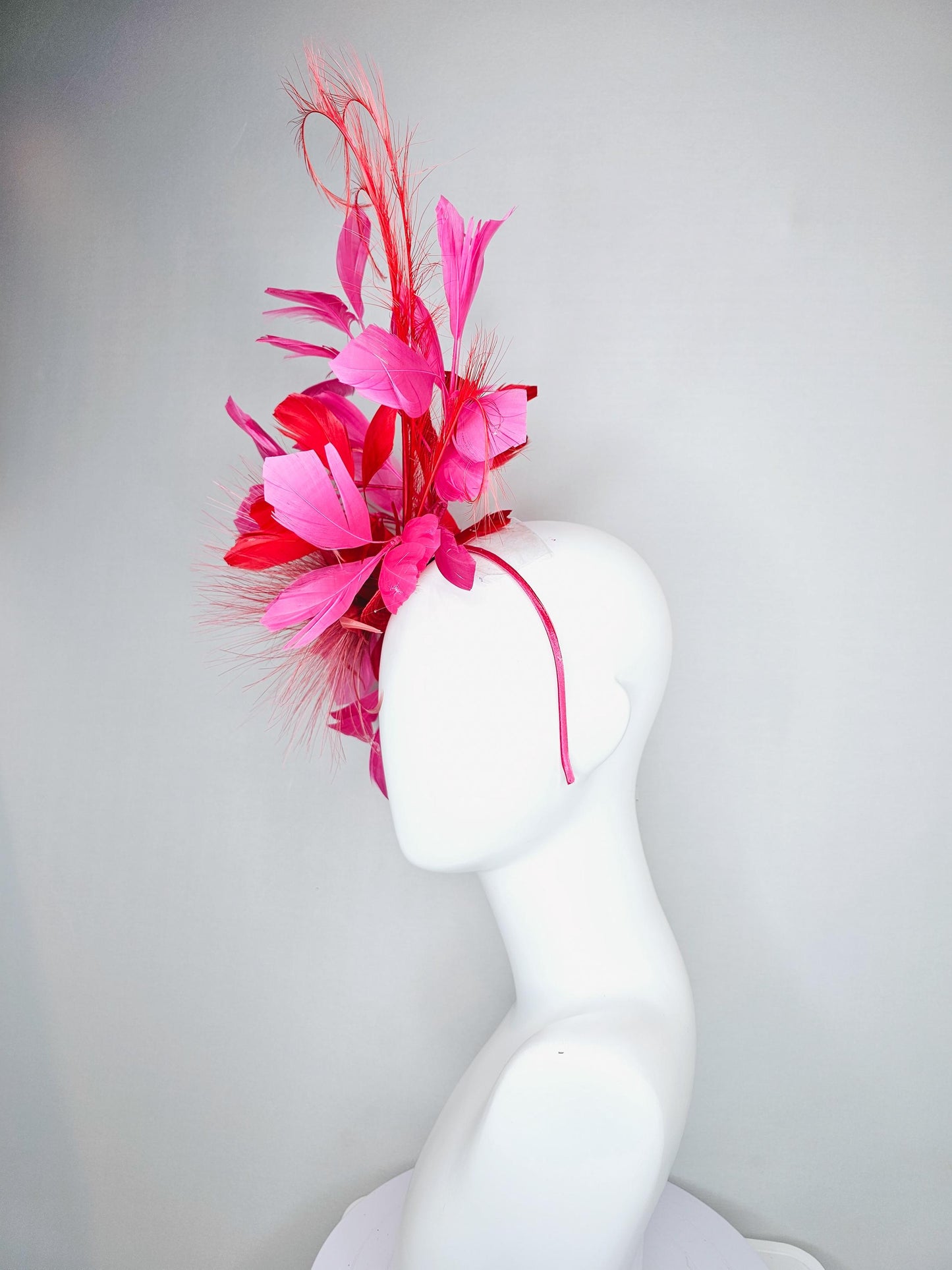 kentucky derby hat fascinator light red spiky feather flower, cherry scarlet red and pink branching feathers and light red feather curls