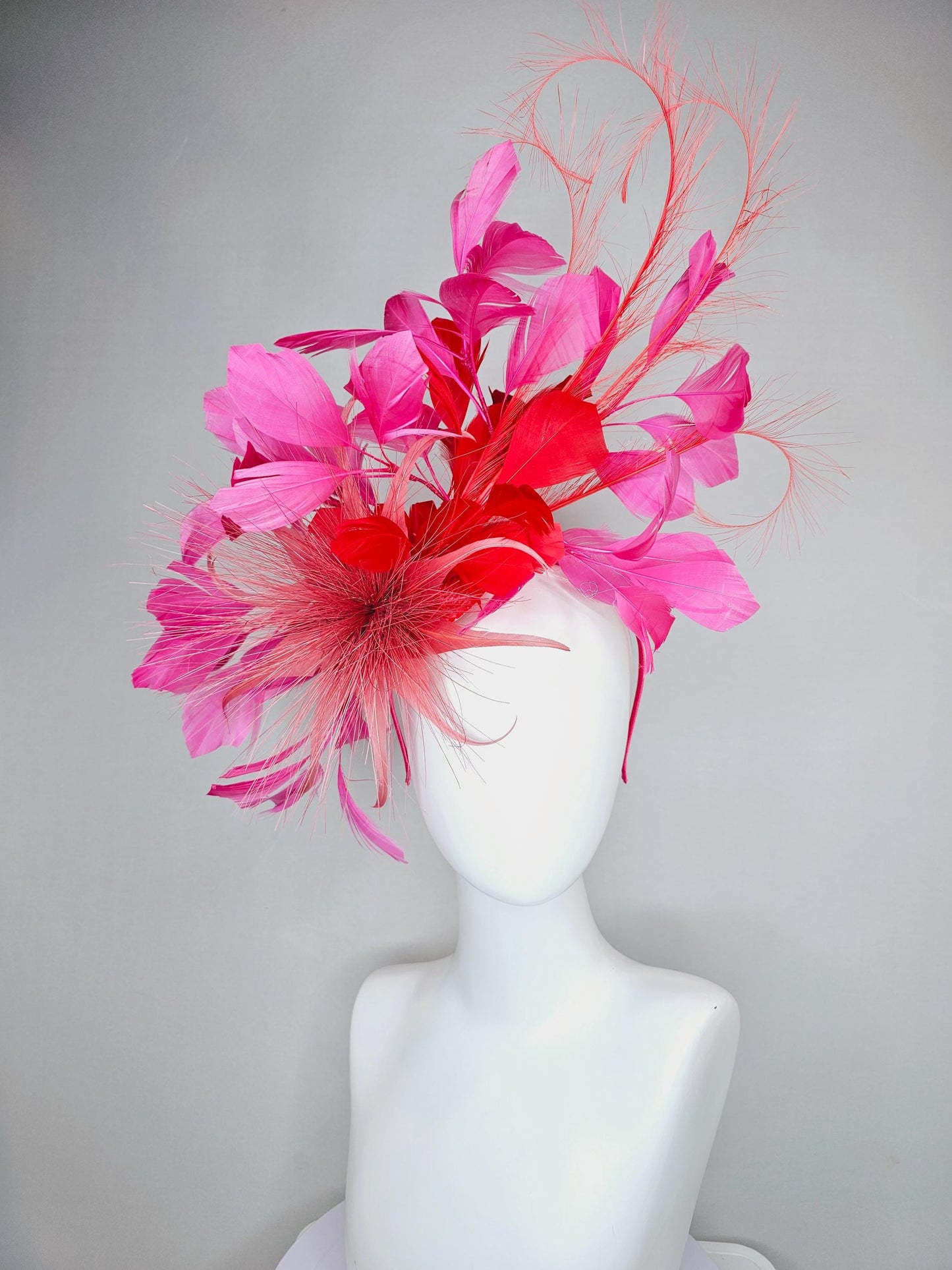 kentucky derby hat fascinator light red spiky feather flower, cherry scarlet red and pink branching feathers and light red feather curls