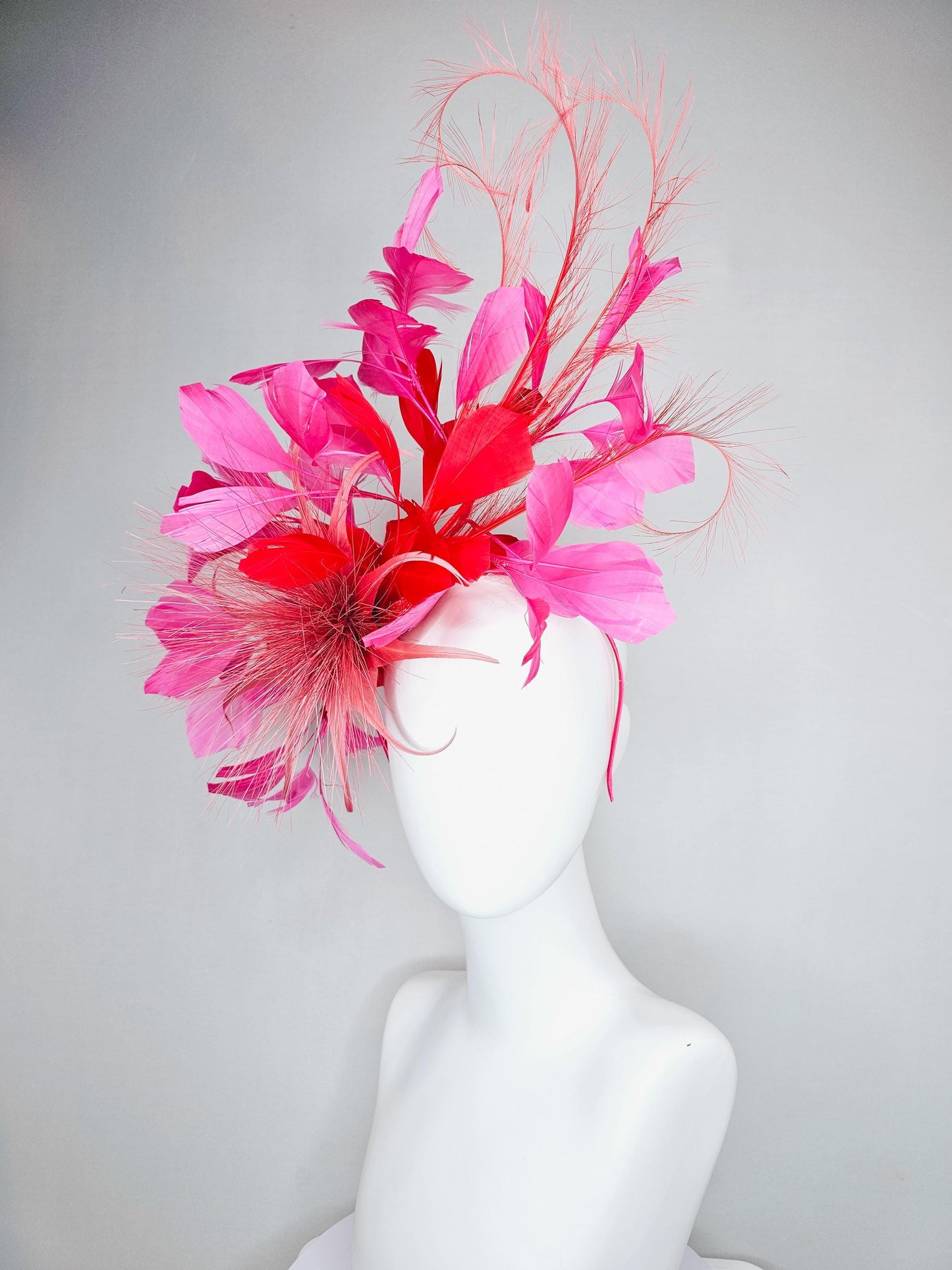 kentucky derby hat fascinator light red spiky feather flower, cherry scarlet red and pink branching feathers and light red feather curls