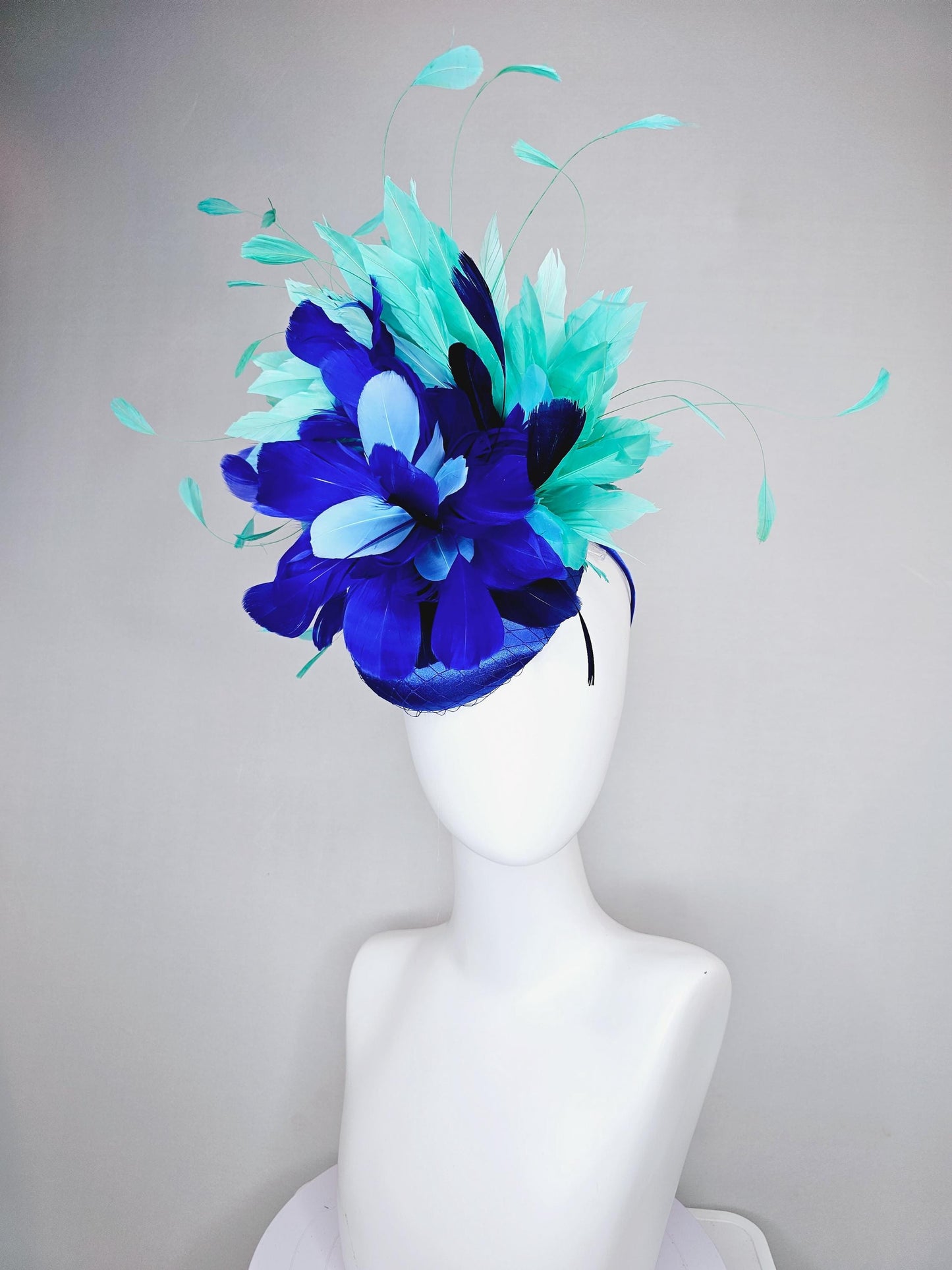 kentucky derby hat fascinator cobalt blue satin with netting and fluffy royal blue light blue navy blue aqua blue green branching feathers