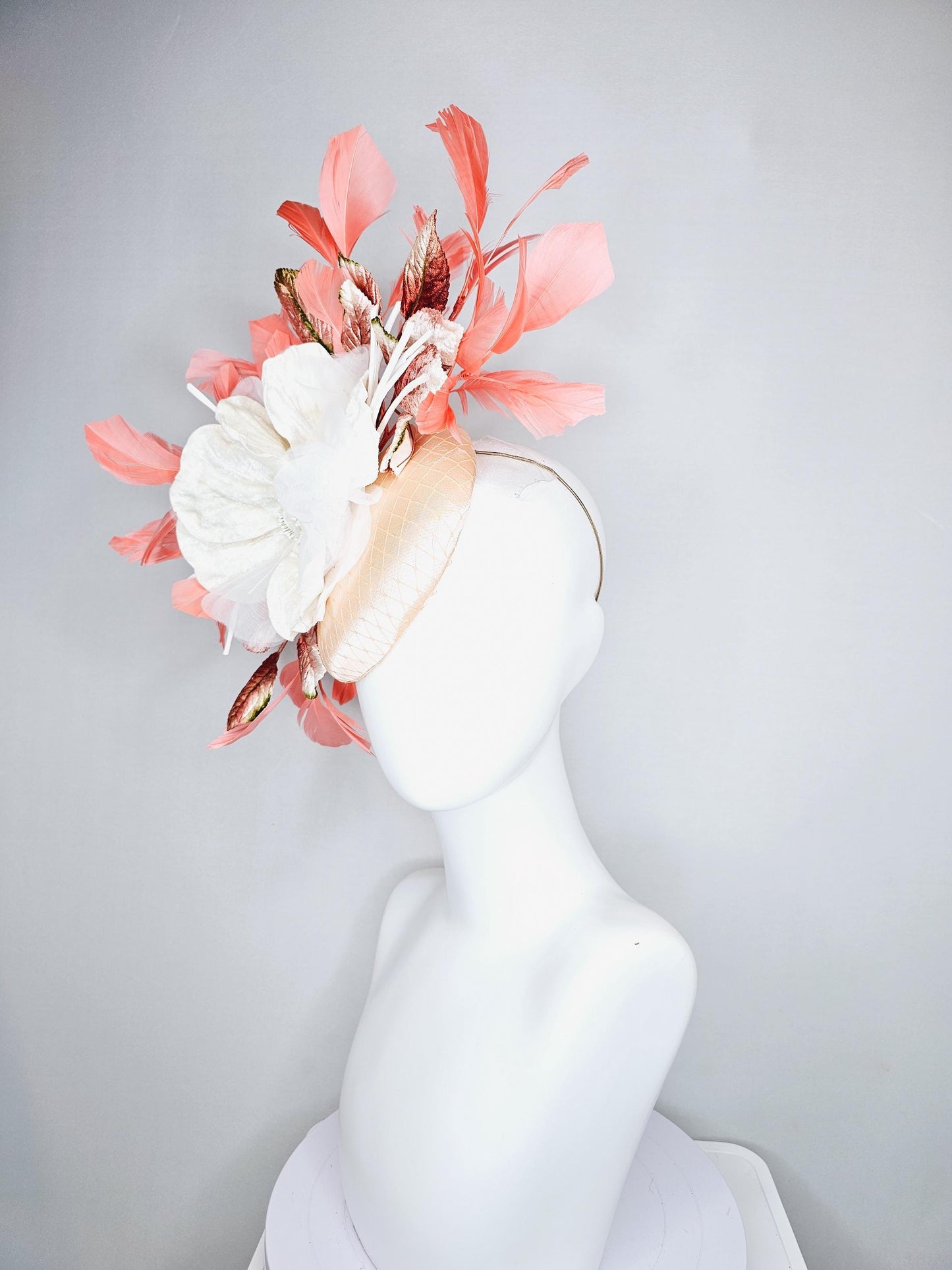 kentucky derby hat fascinator neutral beige satin with netting, white organza flowers, orange ombre leaves, orange peach branching feathers