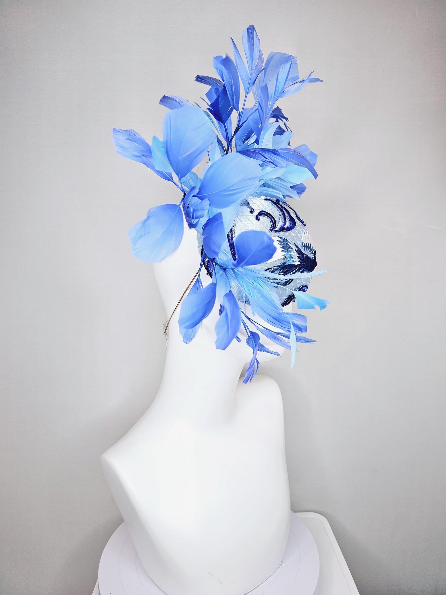 kentucky derby hat fascinator light blue satin with netting embroidered white blue birds, sky blue royal blue cobalt blue branching feathers
