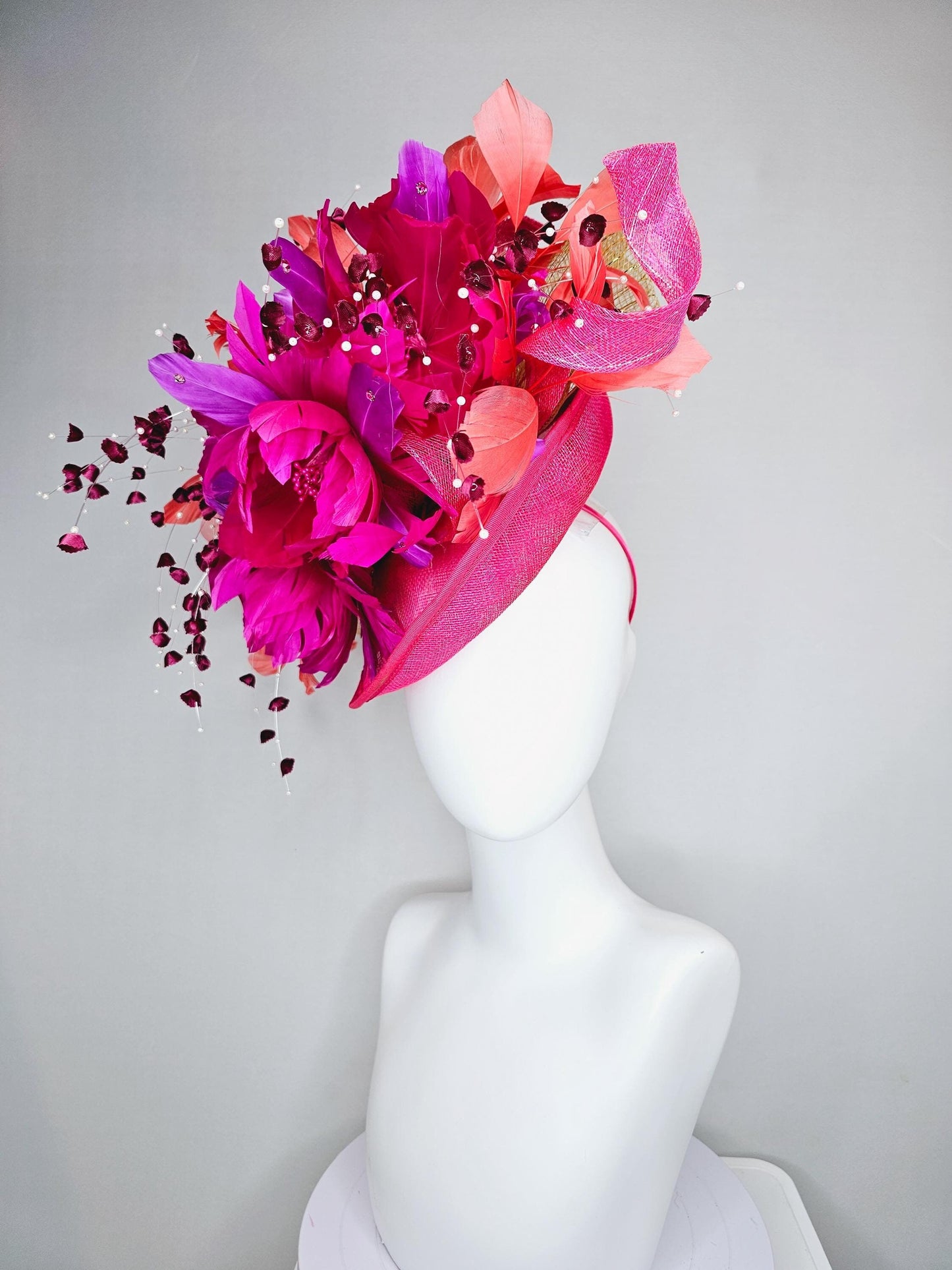 kentucky derby hat fascinator pink sinamay saucer,pink fuchsia feather flowers,pink purple orange branching feathers,pearl and floral stems