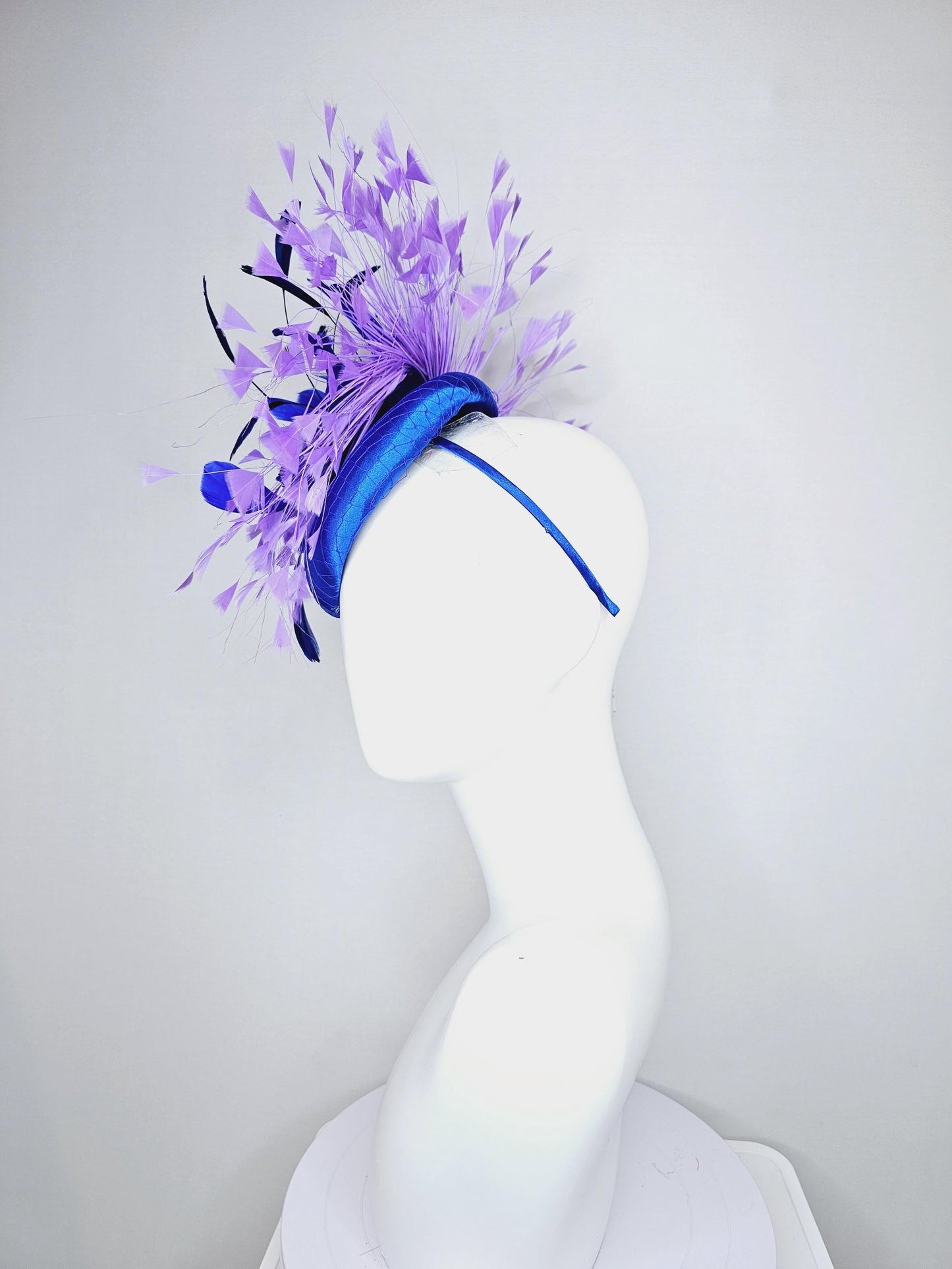 kentucky derby hat fascinator royal blue satin with netting, fluffy royal blue, navy blue, lavender purple branching feathers