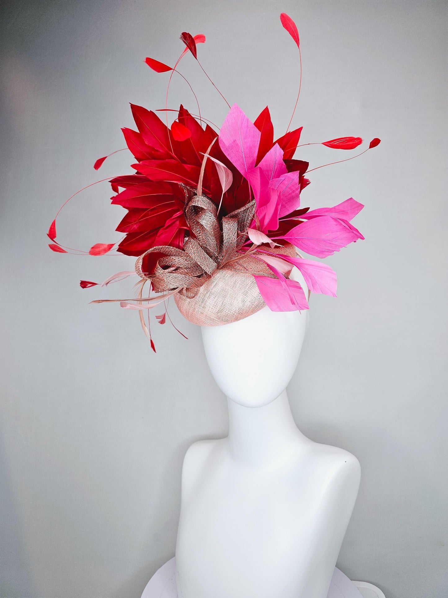 kentucky derby hat fascinator light pink sinamay with dusty pink sinamay bow and dusty pink feathers pink and scarlet red branching feathers