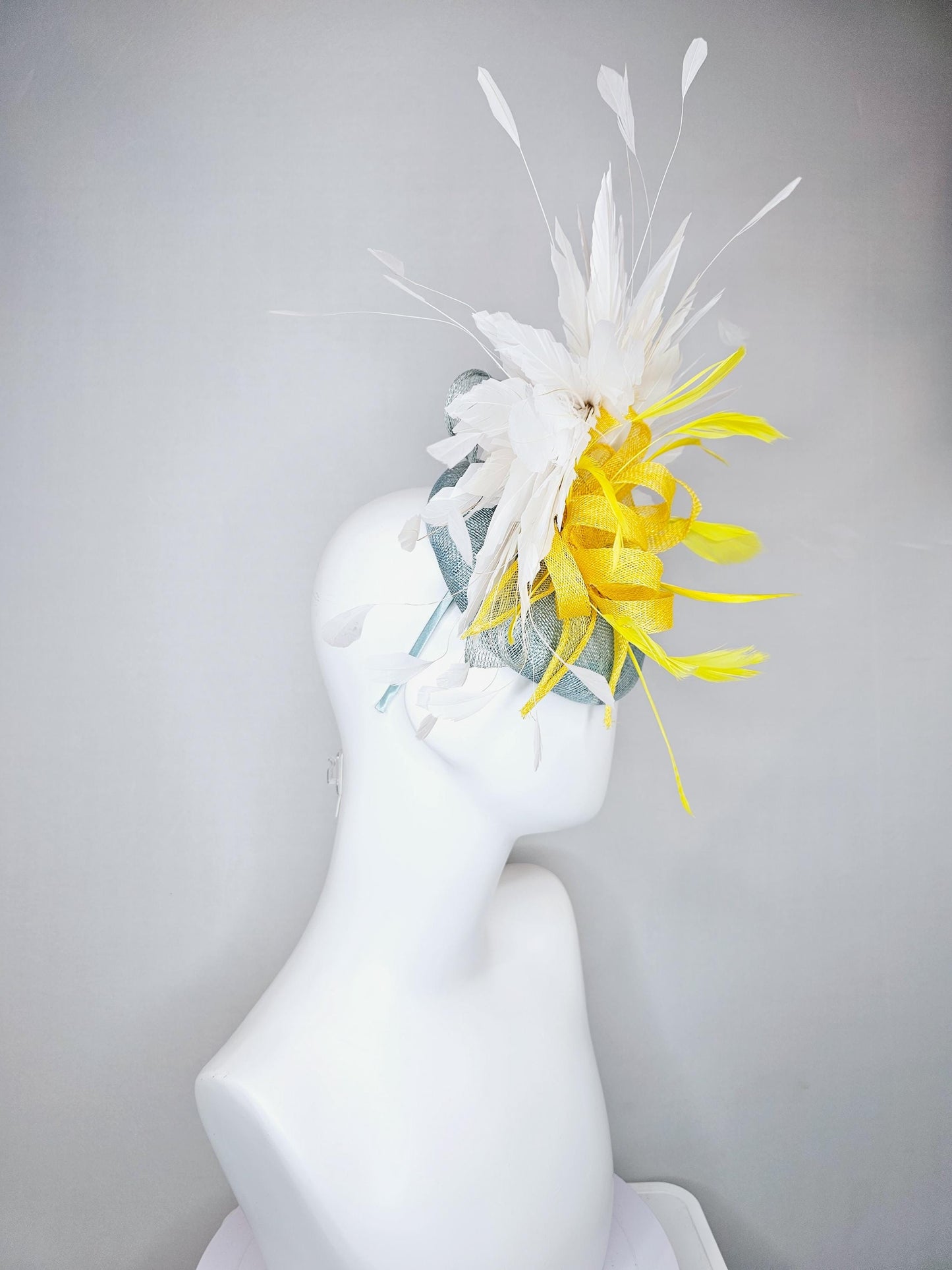kentucky derby hat fascinator light blue sinamay with yellow sinamay bow and yellow feathers, white branching feathers