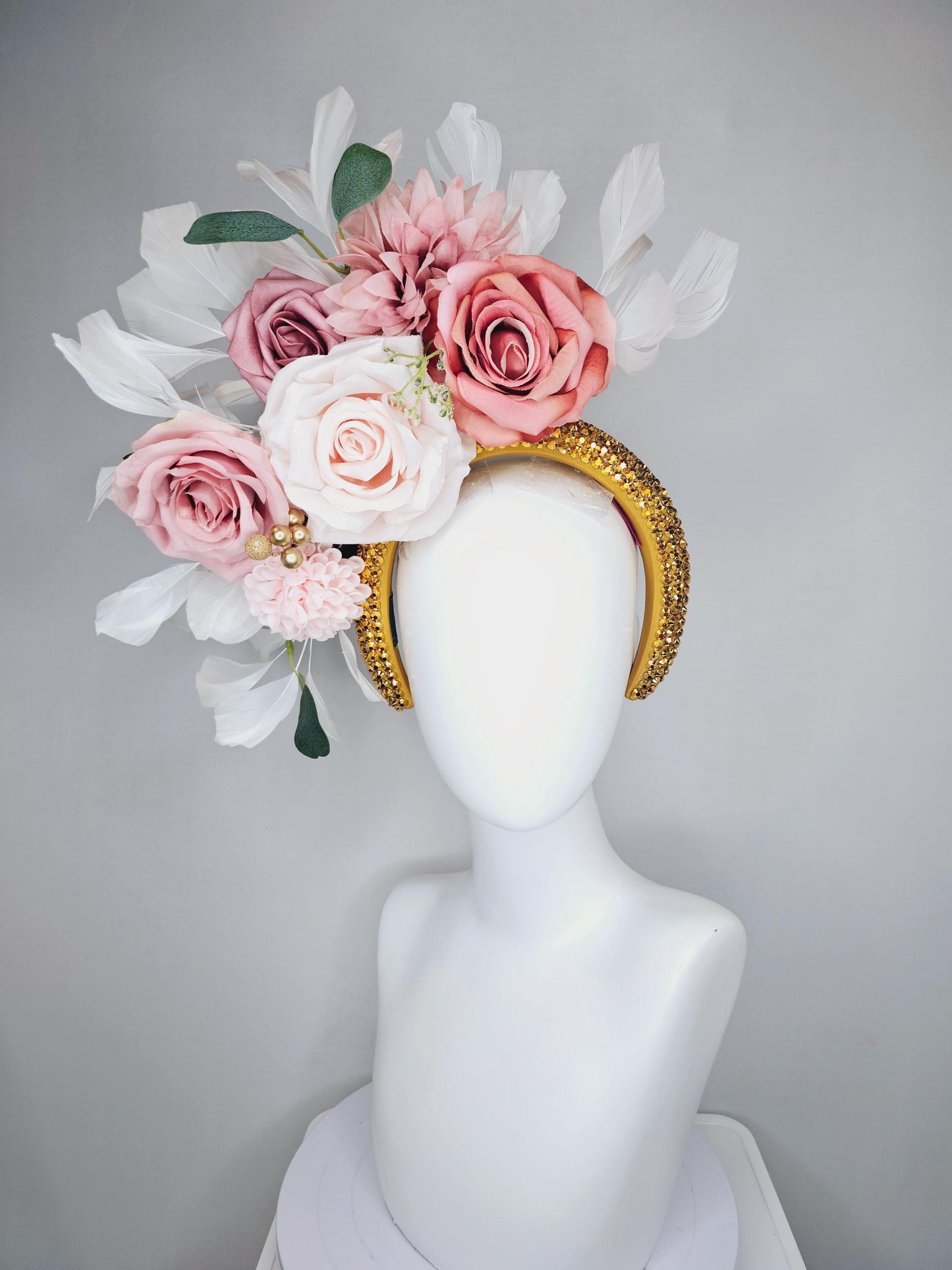 kentucky derby hat fascinator gold crystal headband, light pink dusty pink satin flowers, green leaves, ivory white feathers