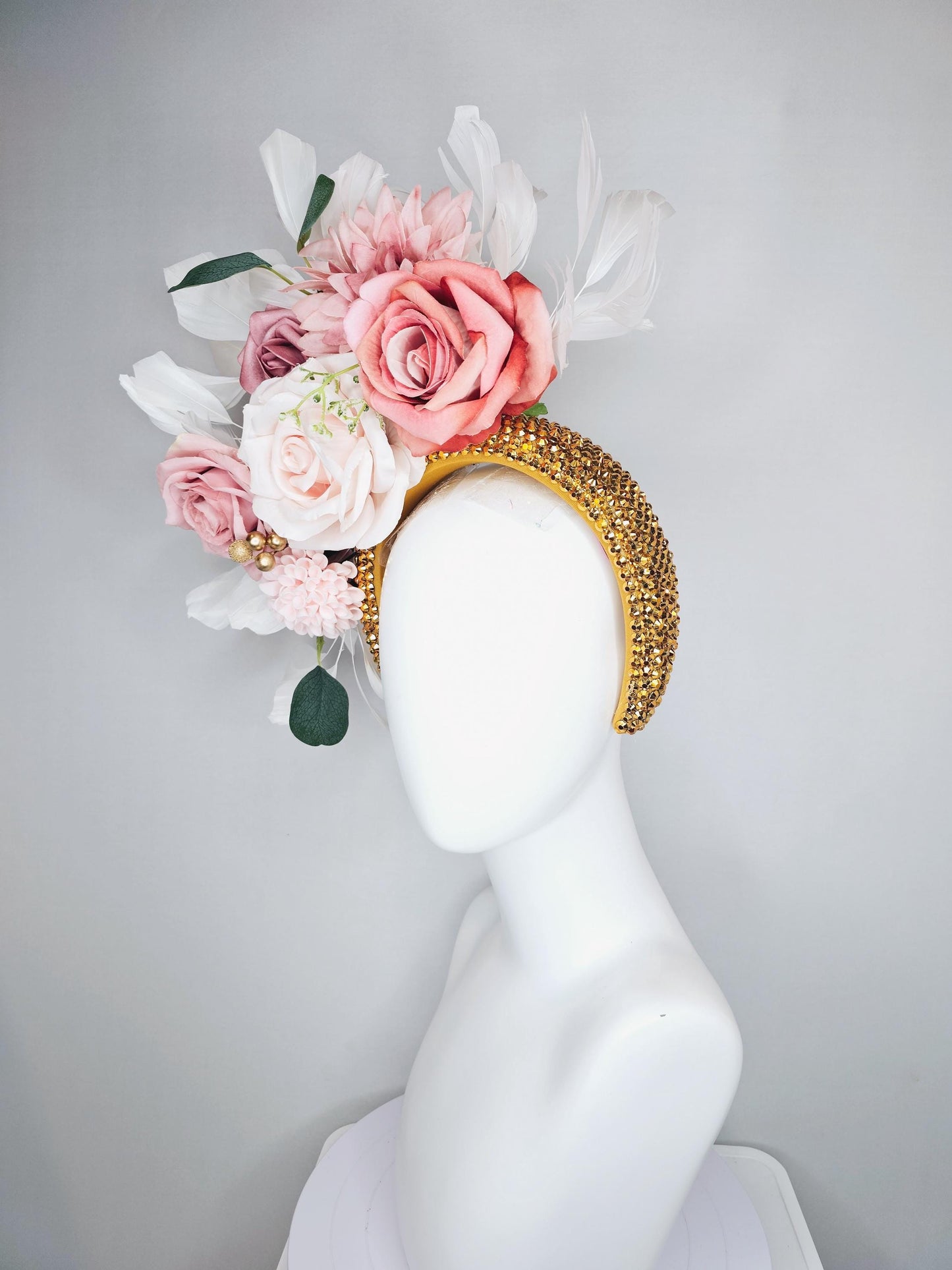 kentucky derby hat fascinator gold crystal headband, light pink dusty pink satin flowers, green leaves, ivory white feathers