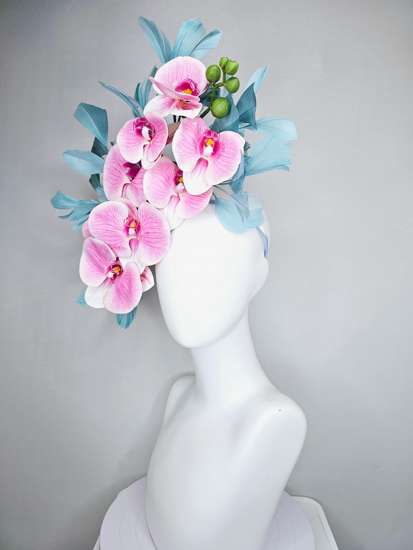 kentucky derby hat fascinator large white and blush pink orchid satin silk flowers, teal blue branching feathers