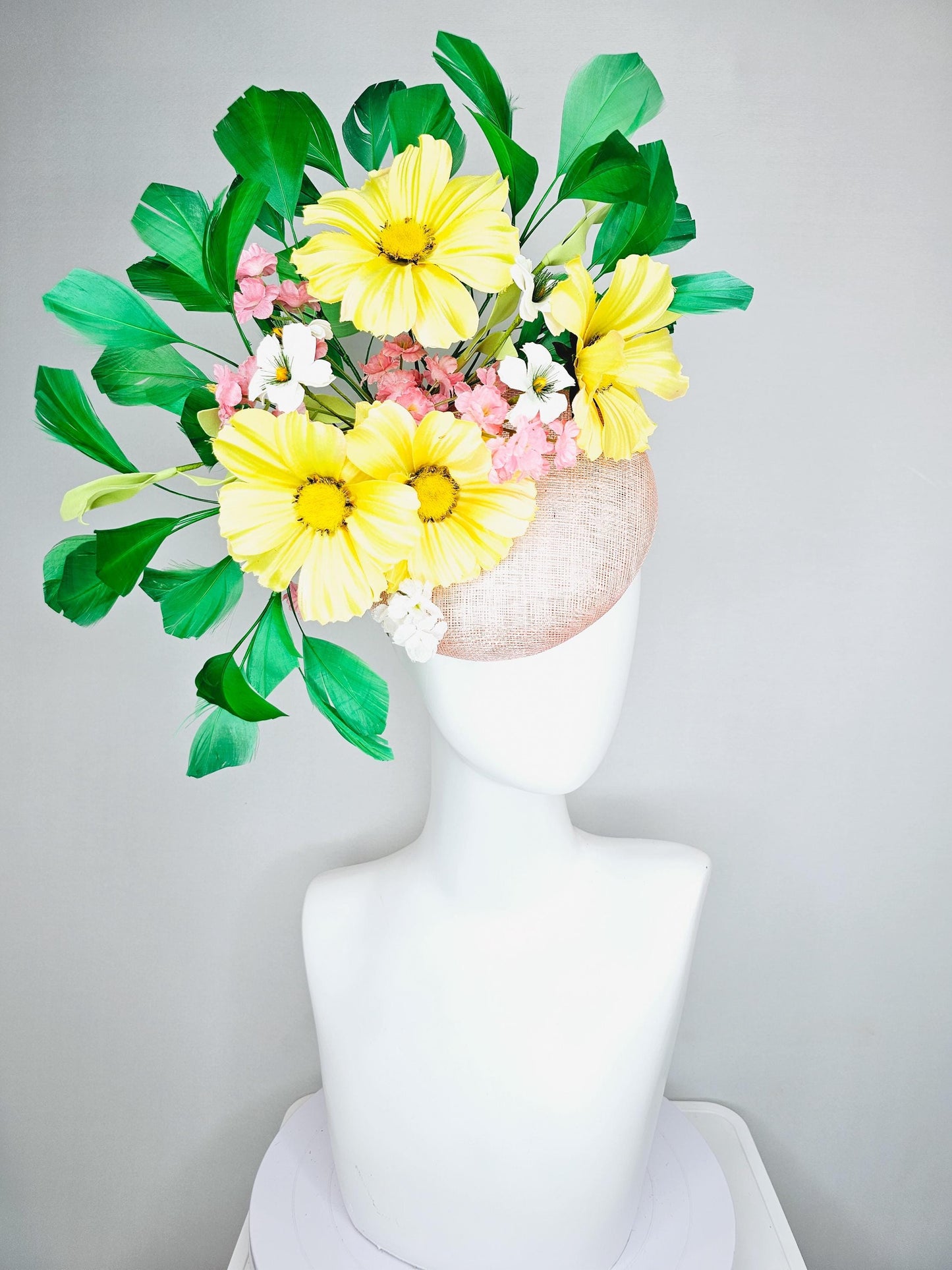 kentucky derby hat fascinator light pink sinamay with yellow white blush pink satin flowers, green leaves, emerald green branching feathers