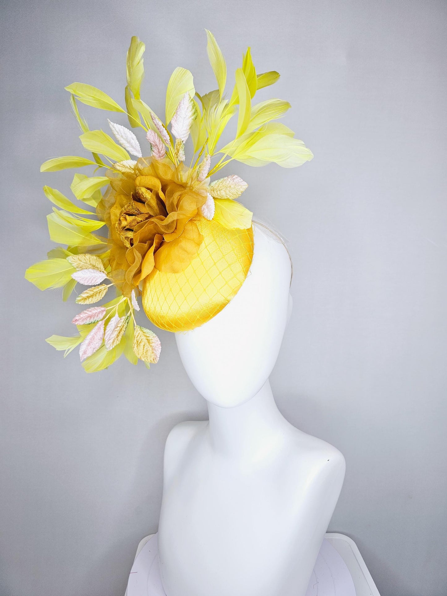 kentucky derby hat fascinator yellow satin with netting mustard yellow organza flower light pink yellow leaves yellow branching feathers