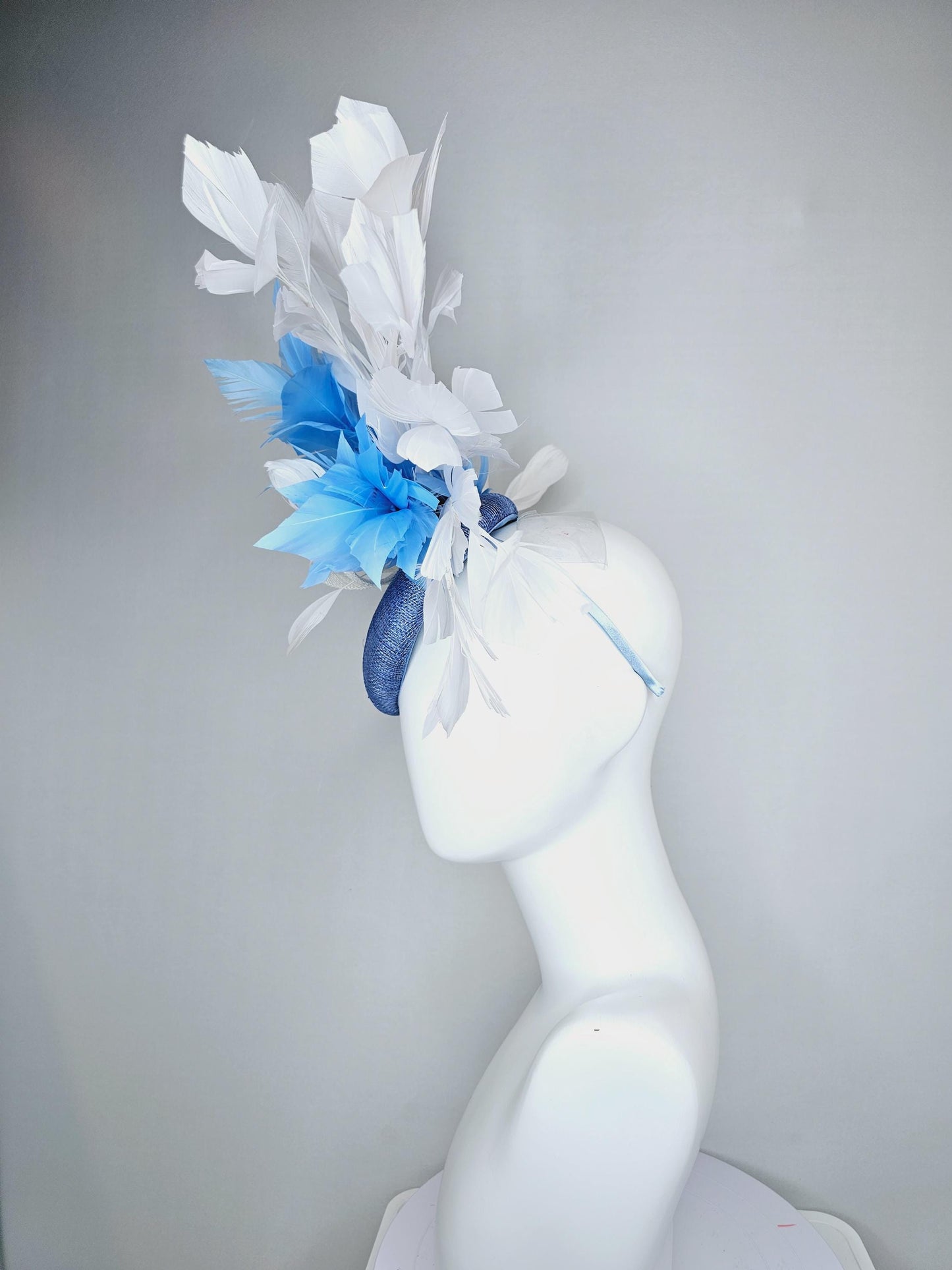 kentucky derby hat fascinator dark blue sinamay base with white sinamay bow, sky blue and white branching feathers