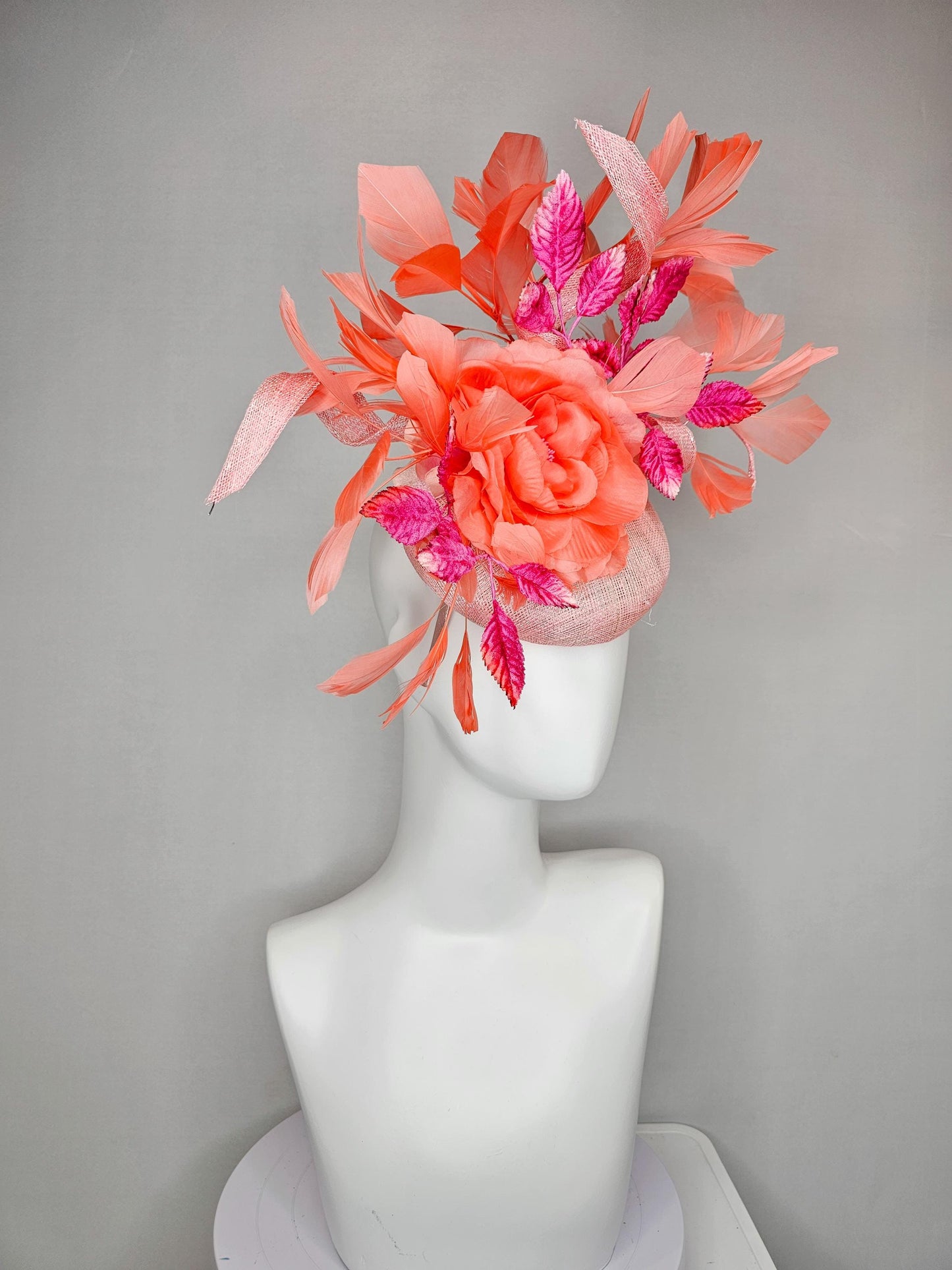 kentucky derby hat fascinator light pink sinamay w/ coral orange peach satin rose flower, bright pink leaves,coral orange branching feathers