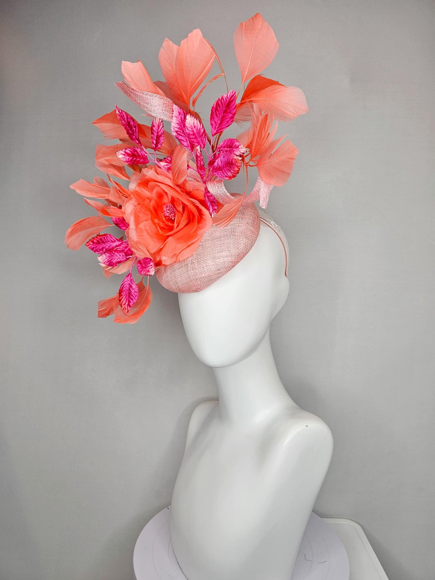 kentucky derby hat fascinator light pink sinamay w/ coral orange peach satin rose flower, bright pink leaves,coral orange branching feathers