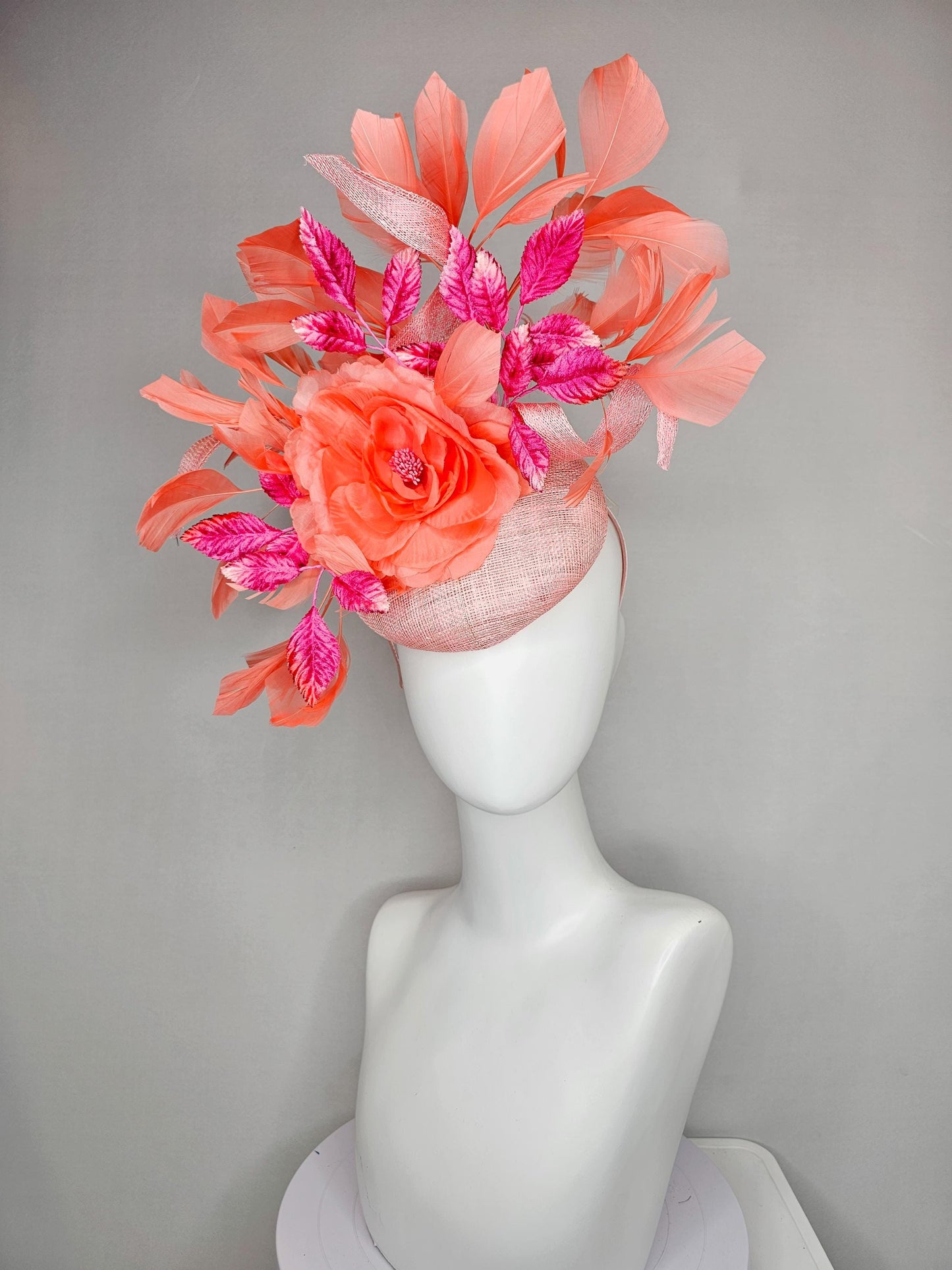 kentucky derby hat fascinator light pink sinamay w/ coral orange peach satin rose flower, bright pink leaves,coral orange branching feathers