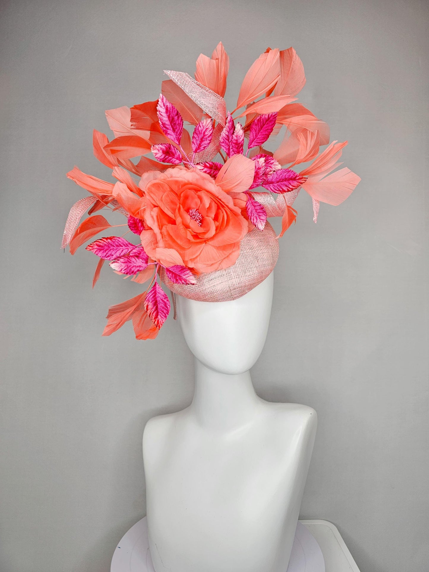 kentucky derby hat fascinator light pink sinamay w/ coral orange peach satin rose flower, bright pink leaves,coral orange branching feathers
