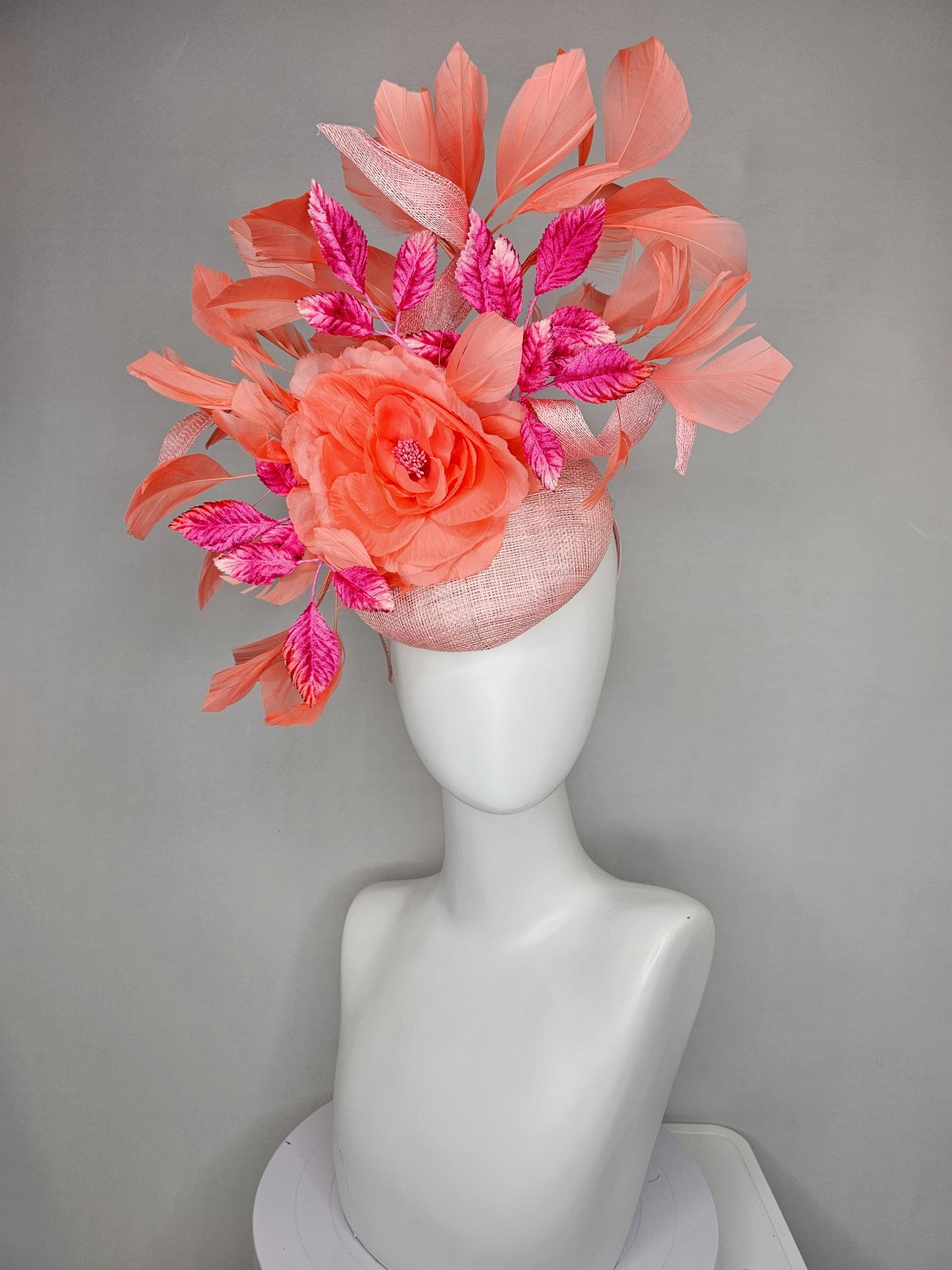 kentucky derby hat fascinator light pink sinamay w/ coral orange peach satin rose flower, bright pink leaves,coral orange branching feathers
