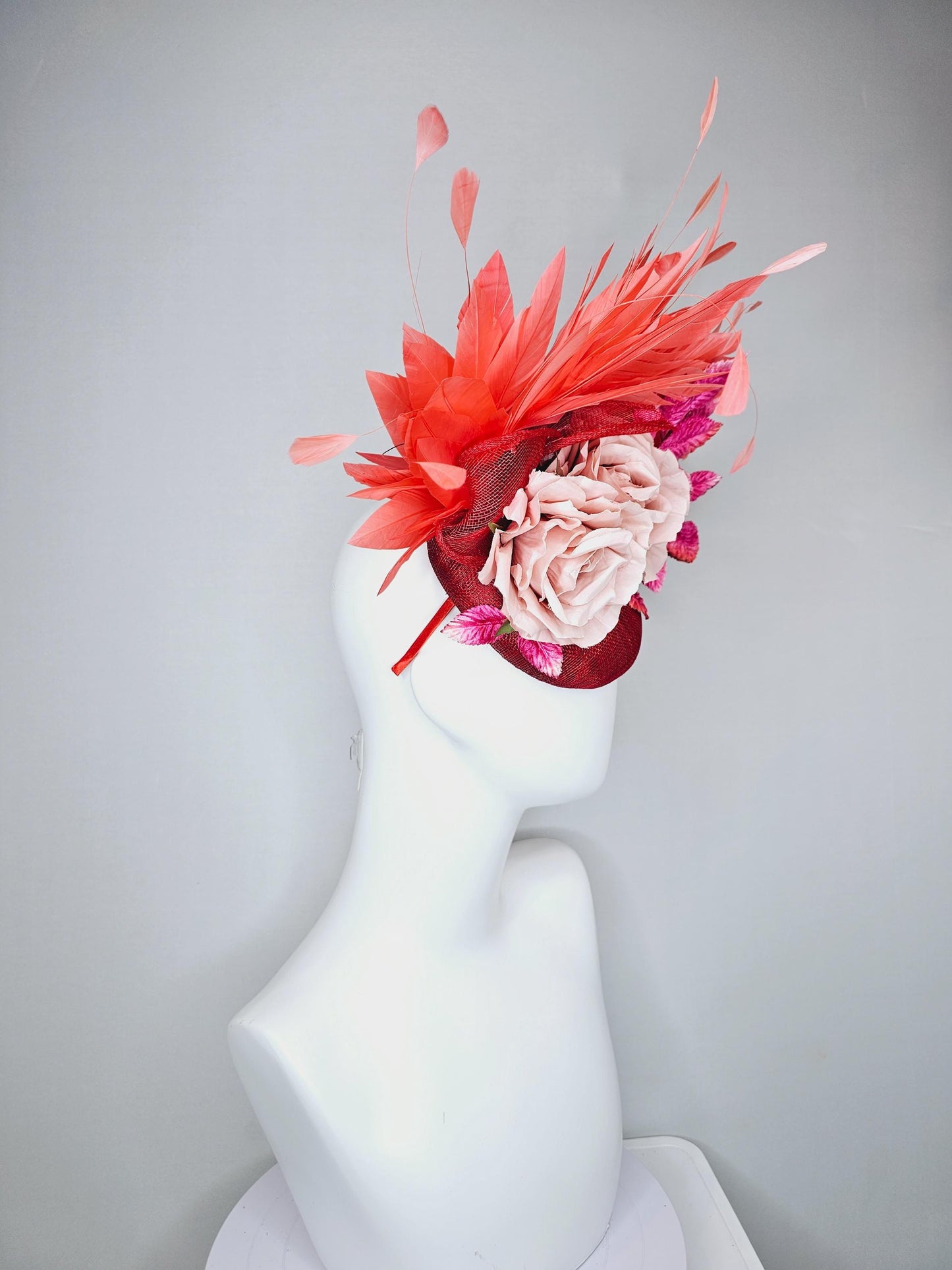 kentucky derby hat fascinator red sinamay with curls coral orange branching feathers pink velvet leaves light rose pink satin silk flowers
