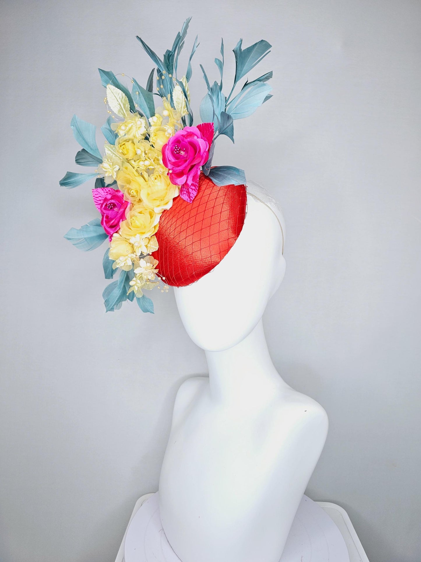 kentucky derby hat fascinator red satin with netting, pink yellow organza satin rose flowers,pink yellow leaves,teal blue branching feathers