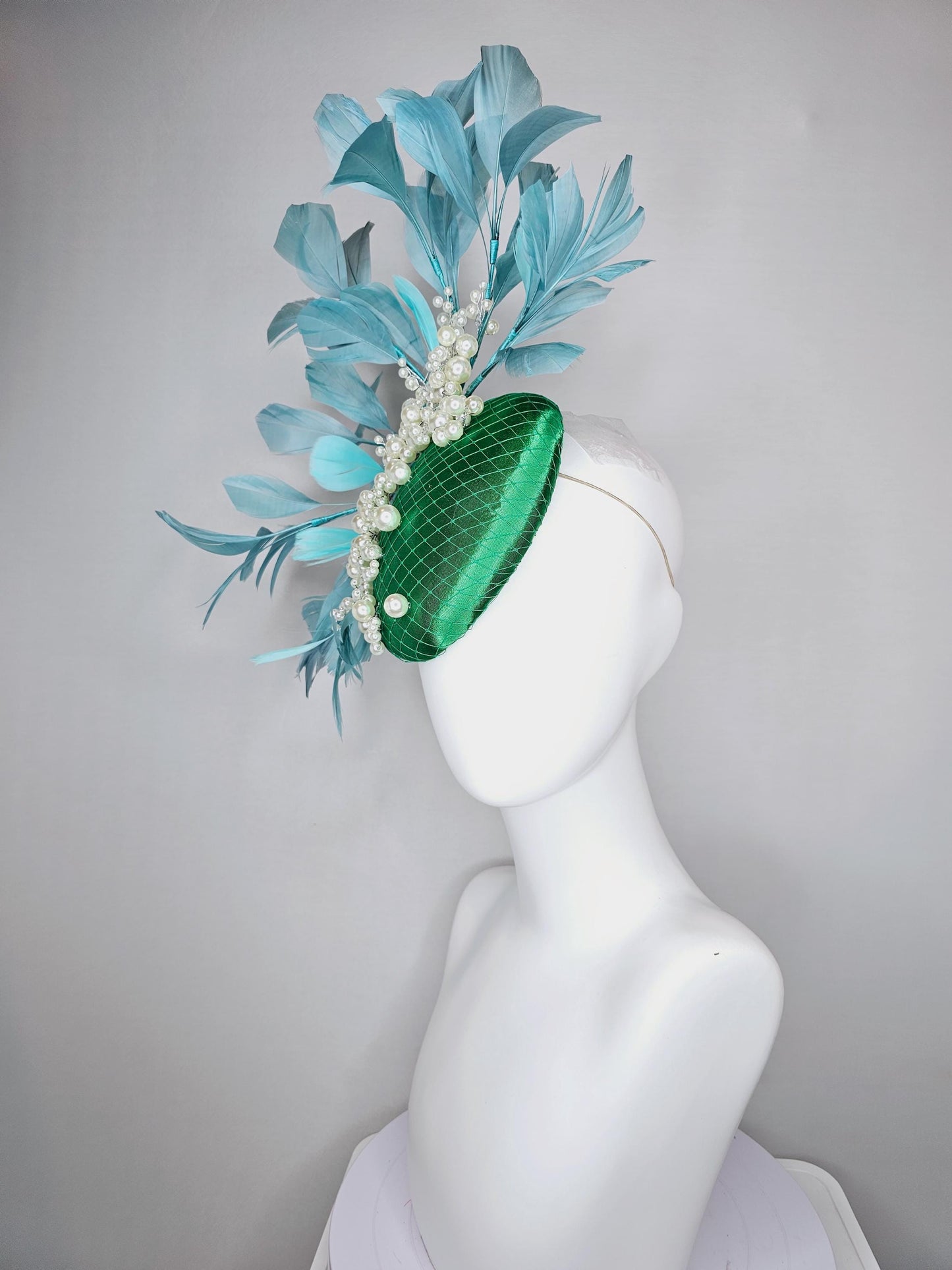 kentucky derby hat fascinator emerald green satin with netting and pearl beaded stems, teal blue branching feathers