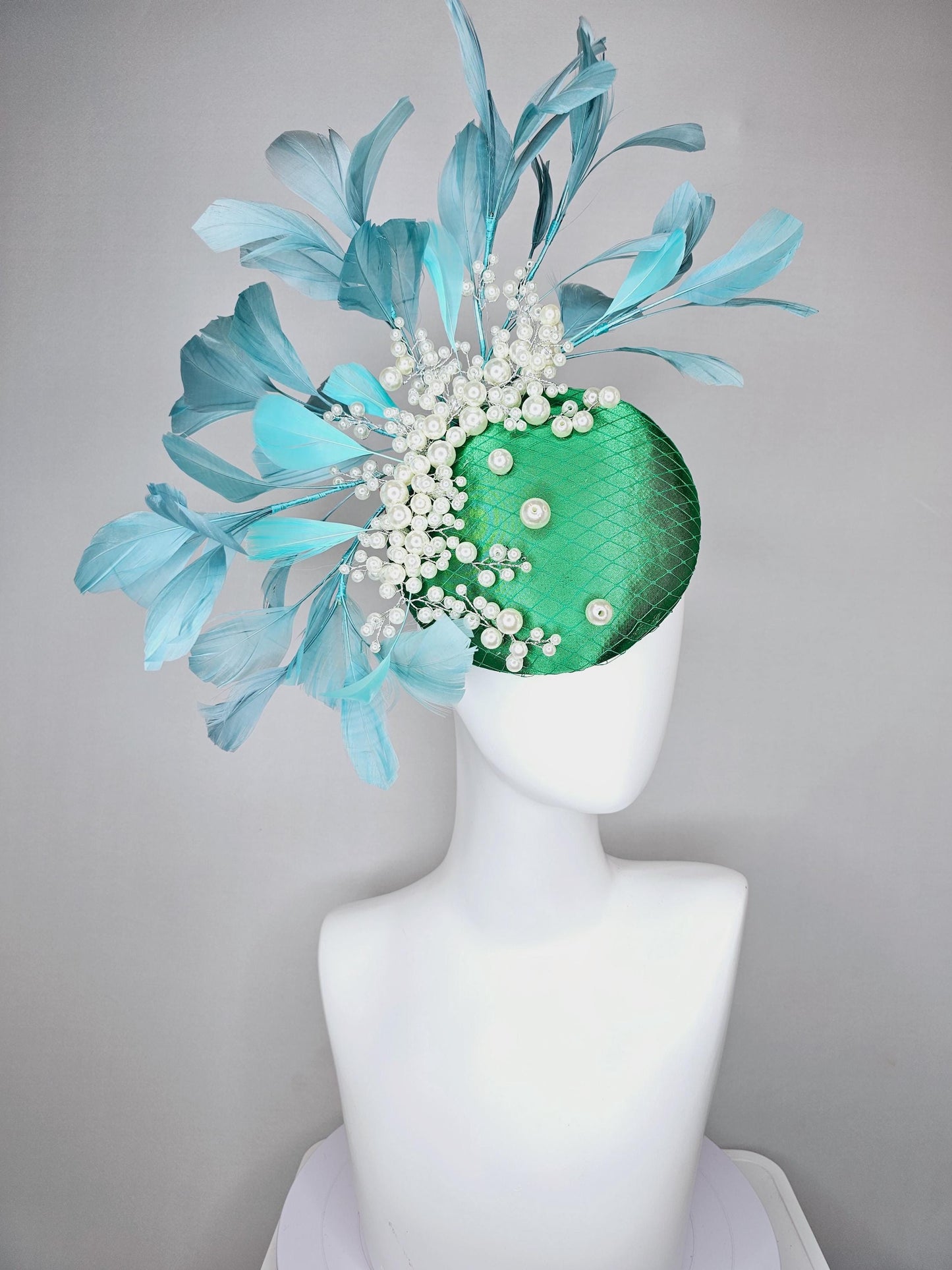 kentucky derby hat fascinator emerald green satin with netting and pearl beaded stems, teal blue branching feathers