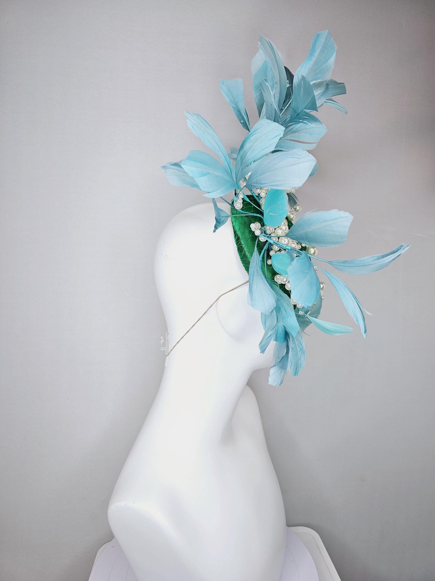 kentucky derby hat fascinator emerald green satin with netting and pearl beaded stems, teal blue branching feathers