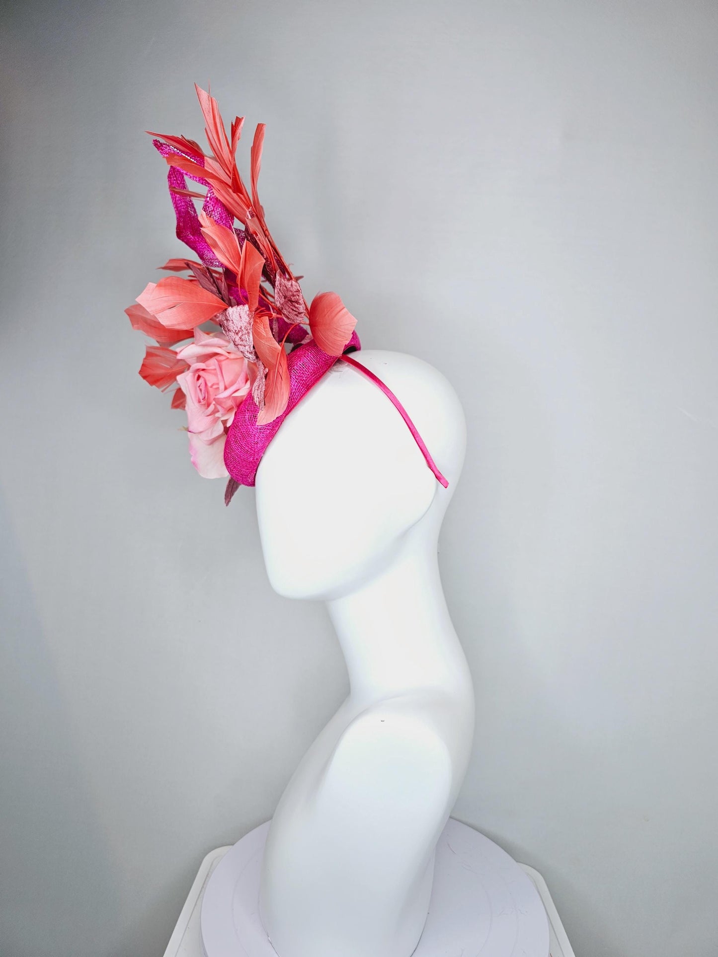 kentucky derby hat fascinator fuchsia pink sinamay with curls, light pink satin roses, dusty pink leaves, coral orange branching feathers
