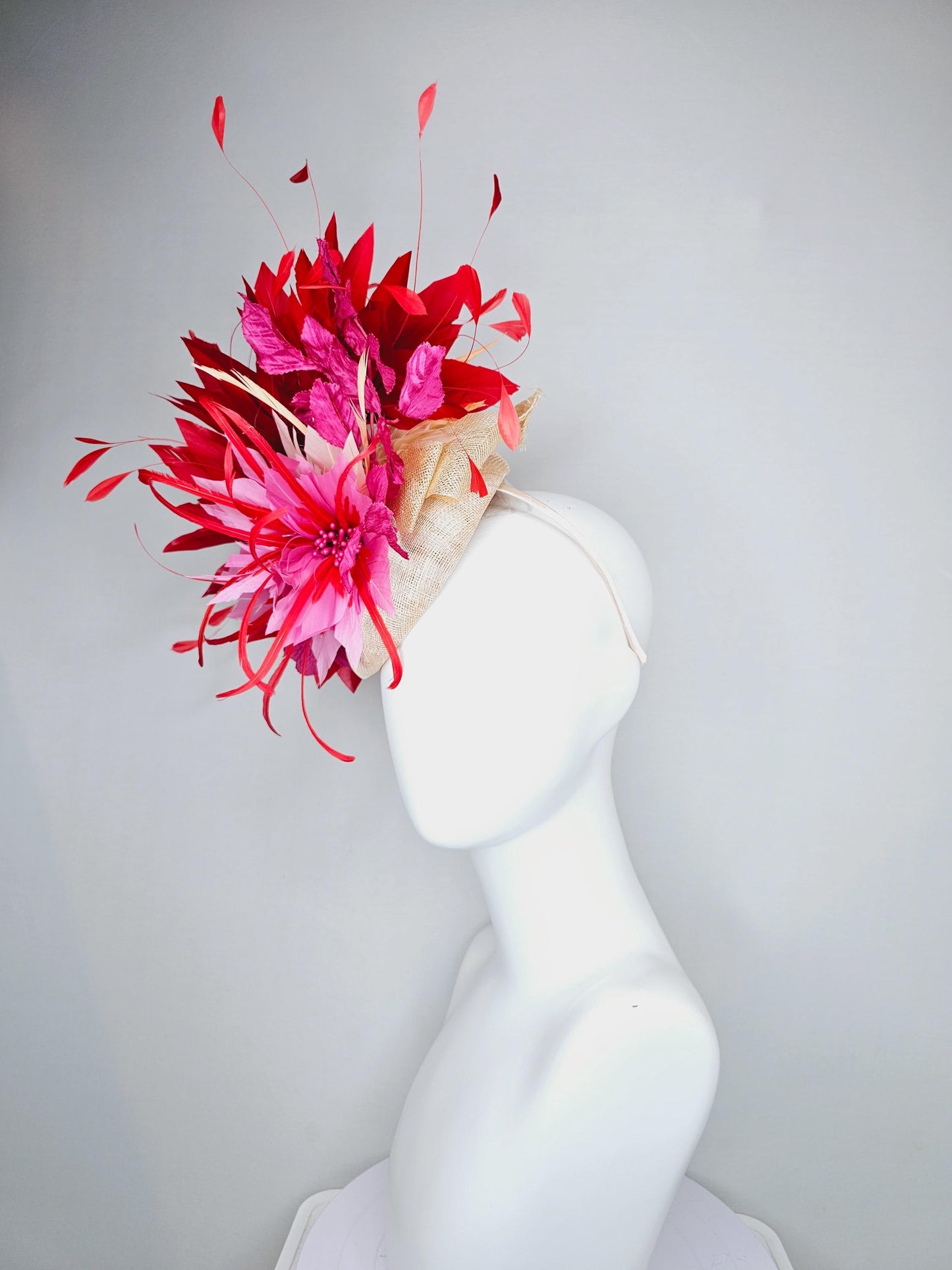 kentucky derby hat fascinator neutral beige sinamay with blush pink beige feather flower, bright pink leaves, scarlet red branching feathers