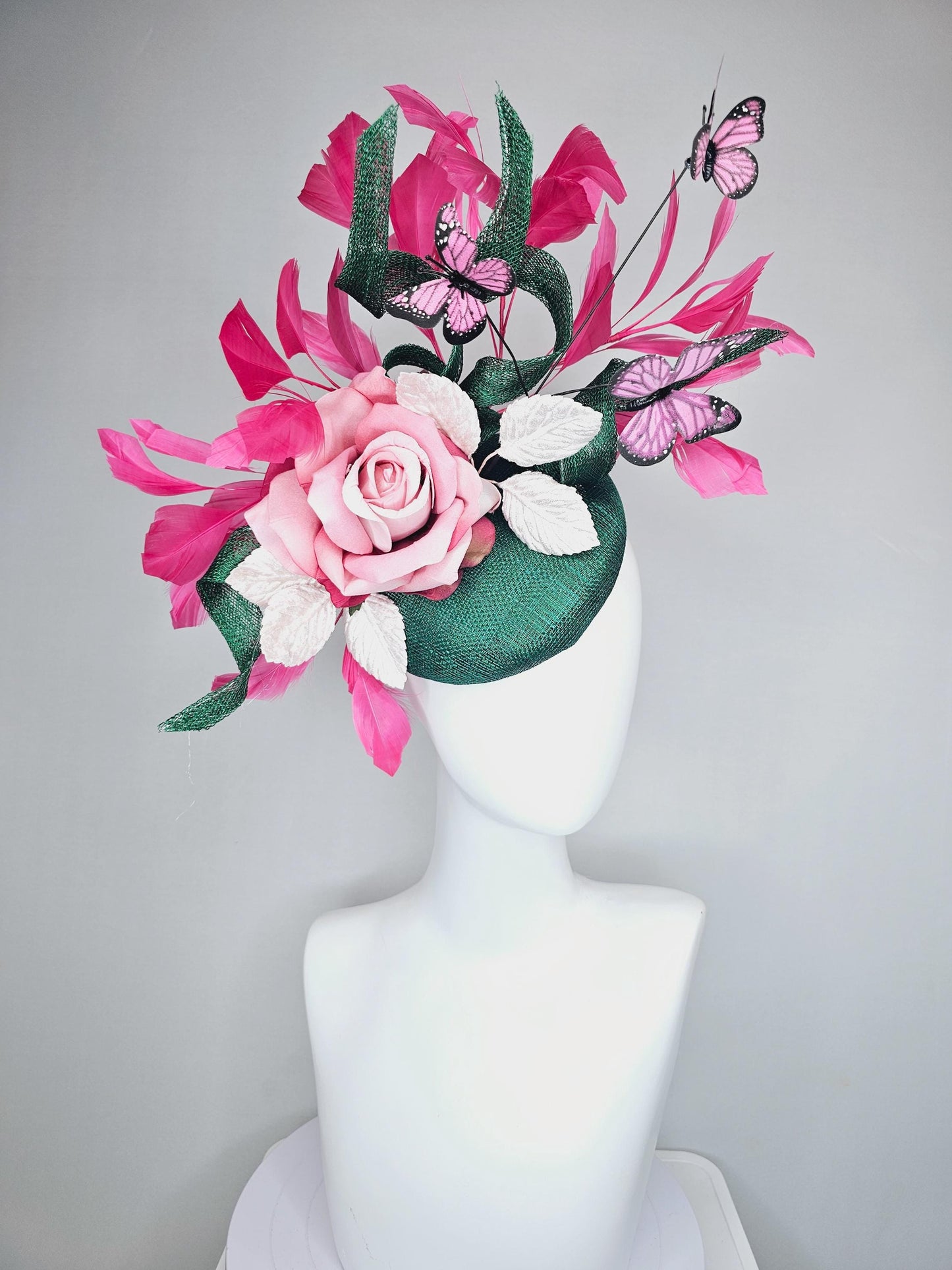 kentucky derby hat fascinator dark green sinamay w/ curls, pink ombre satin rose,white leaves,pink branching feathers,pink black butterflies