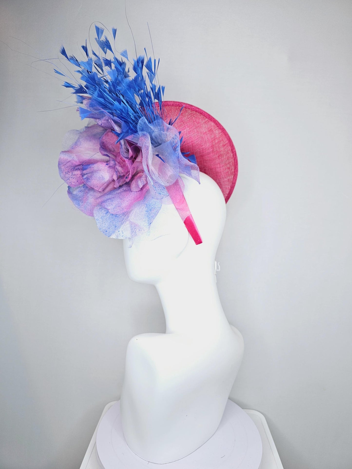 kentucky derby hat fascinator raspberry pink sinamay saucer with large pink blue tie dye organza satin rose, cobalt blue branching feathers