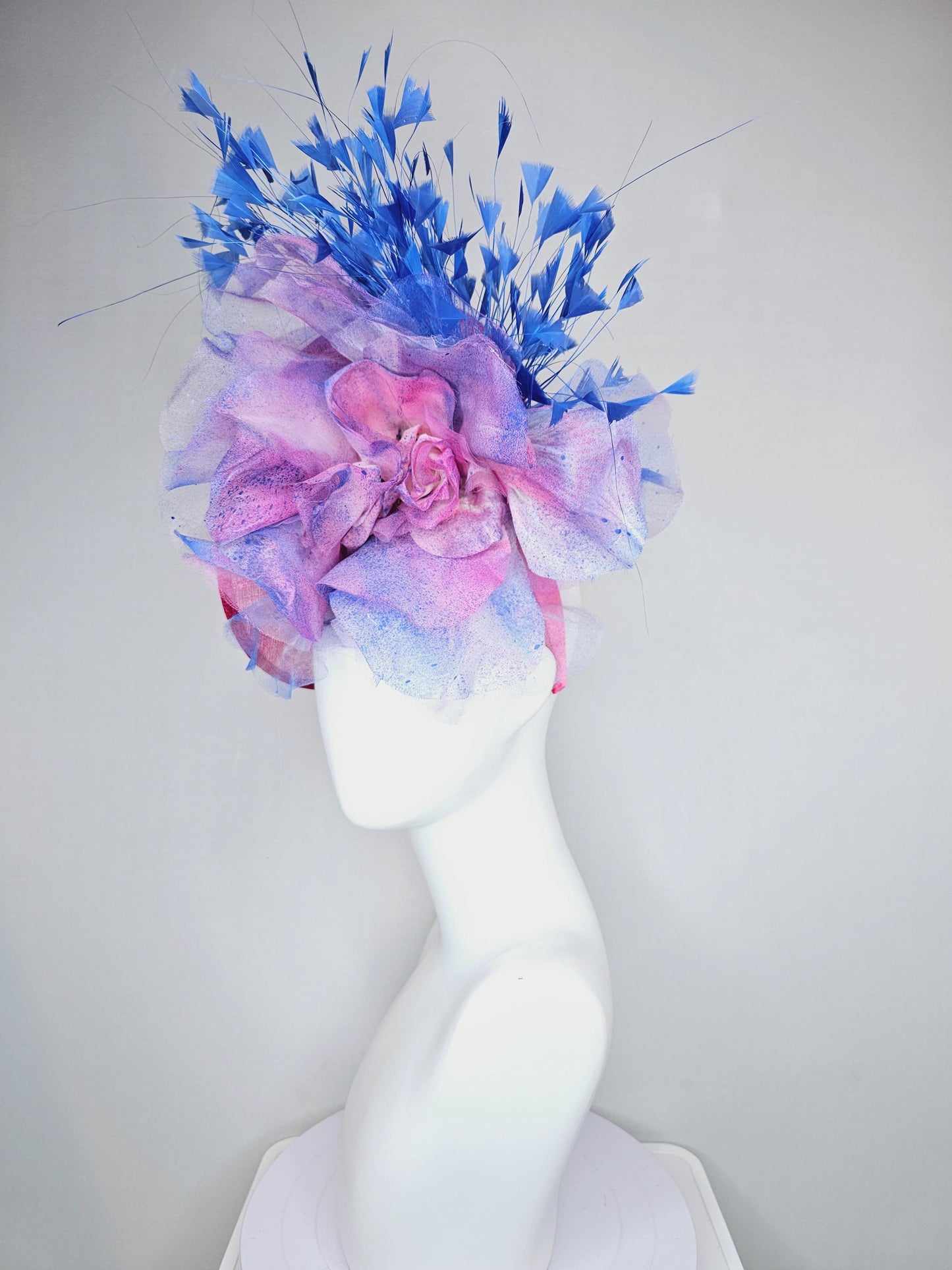 kentucky derby hat fascinator raspberry pink sinamay saucer with large pink blue tie dye organza satin rose, cobalt blue branching feathers