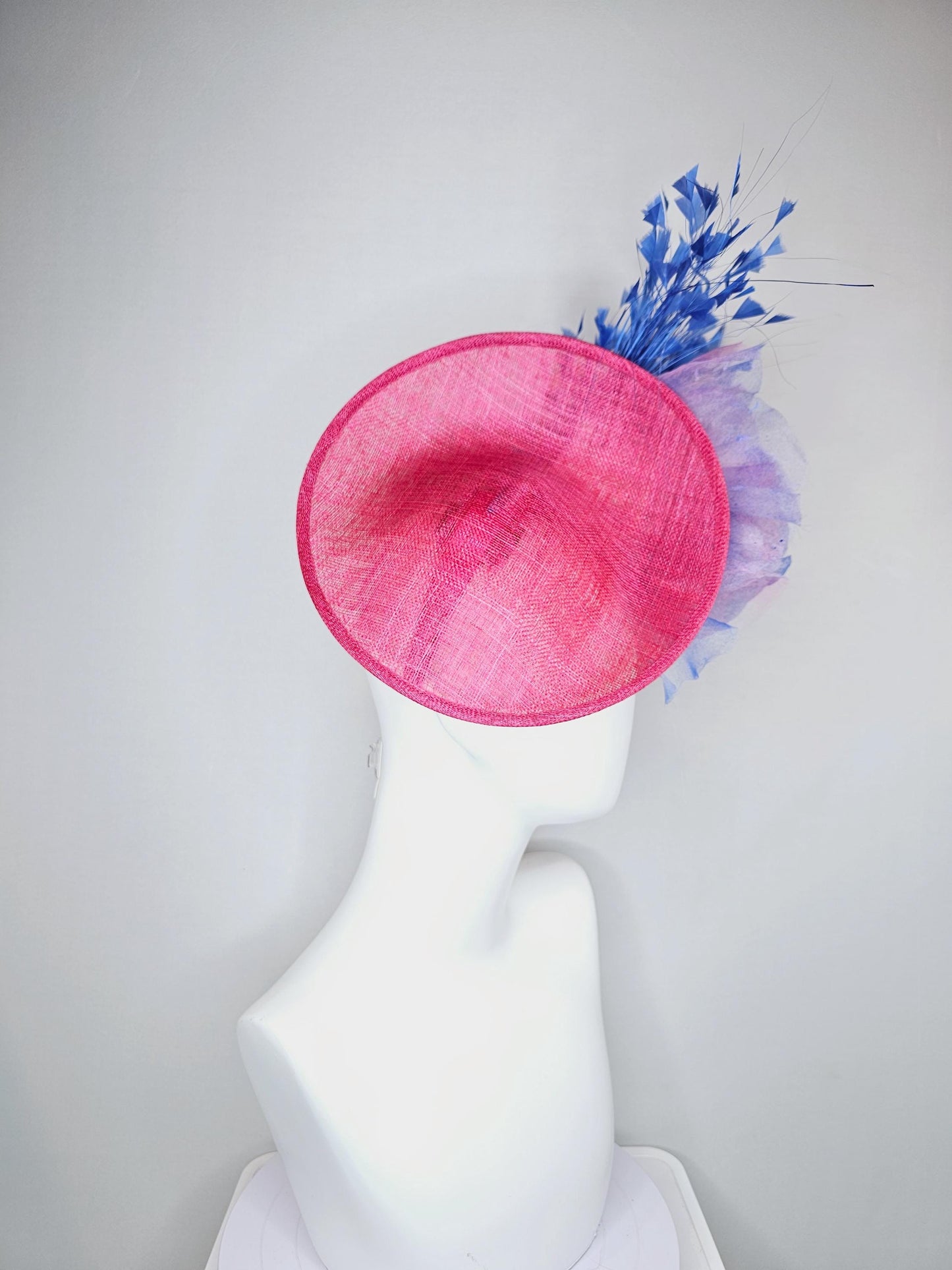 kentucky derby hat fascinator raspberry pink sinamay saucer with large pink blue tie dye organza satin rose, cobalt blue branching feathers