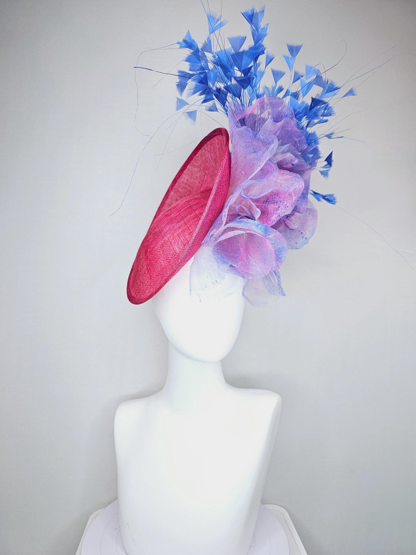 kentucky derby hat fascinator raspberry pink sinamay saucer with large pink blue tie dye organza satin rose, cobalt blue branching feathers